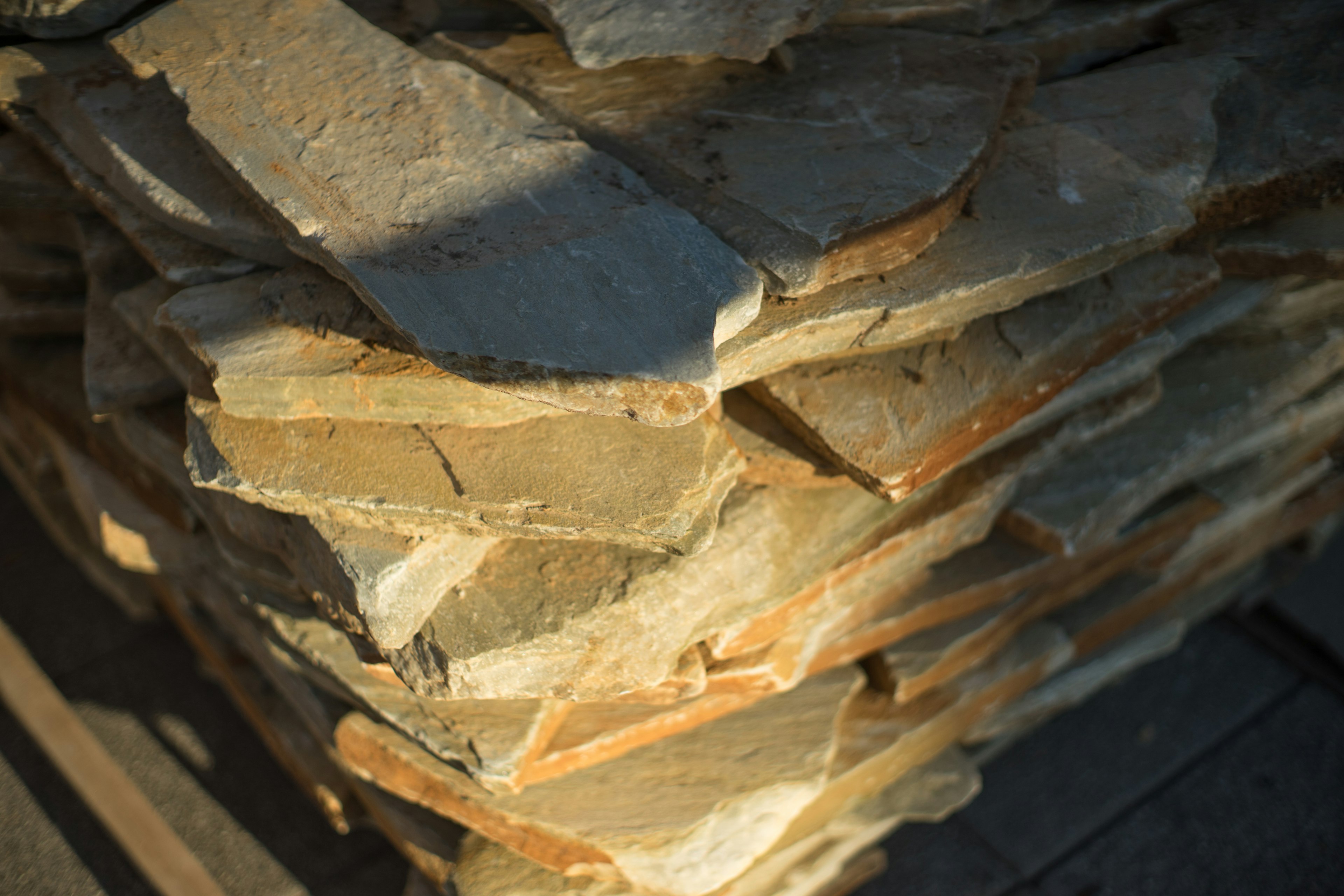 Stacked slate stone layers showing texture and color variations