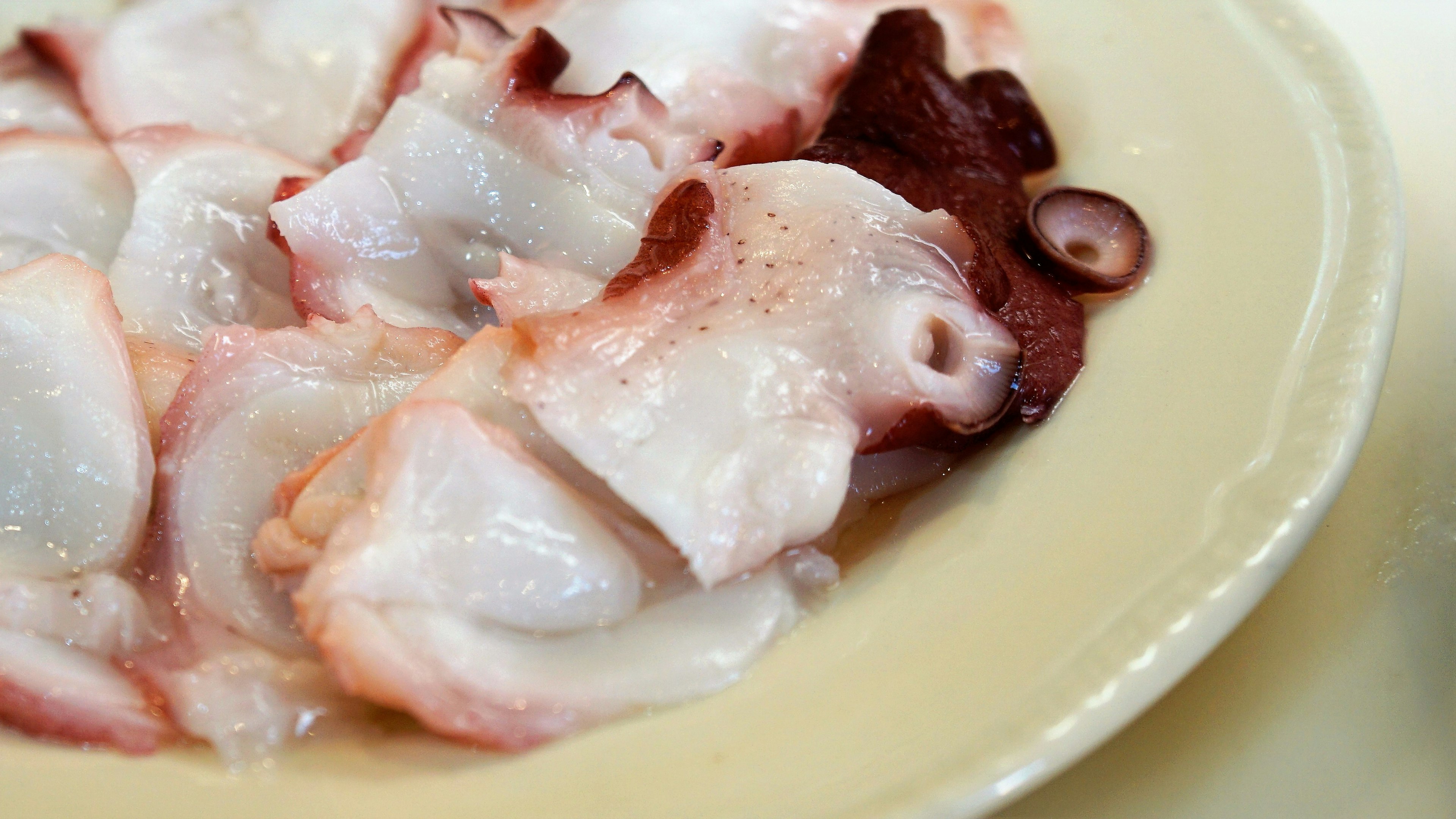 Sliced octopus sashimi on a plate