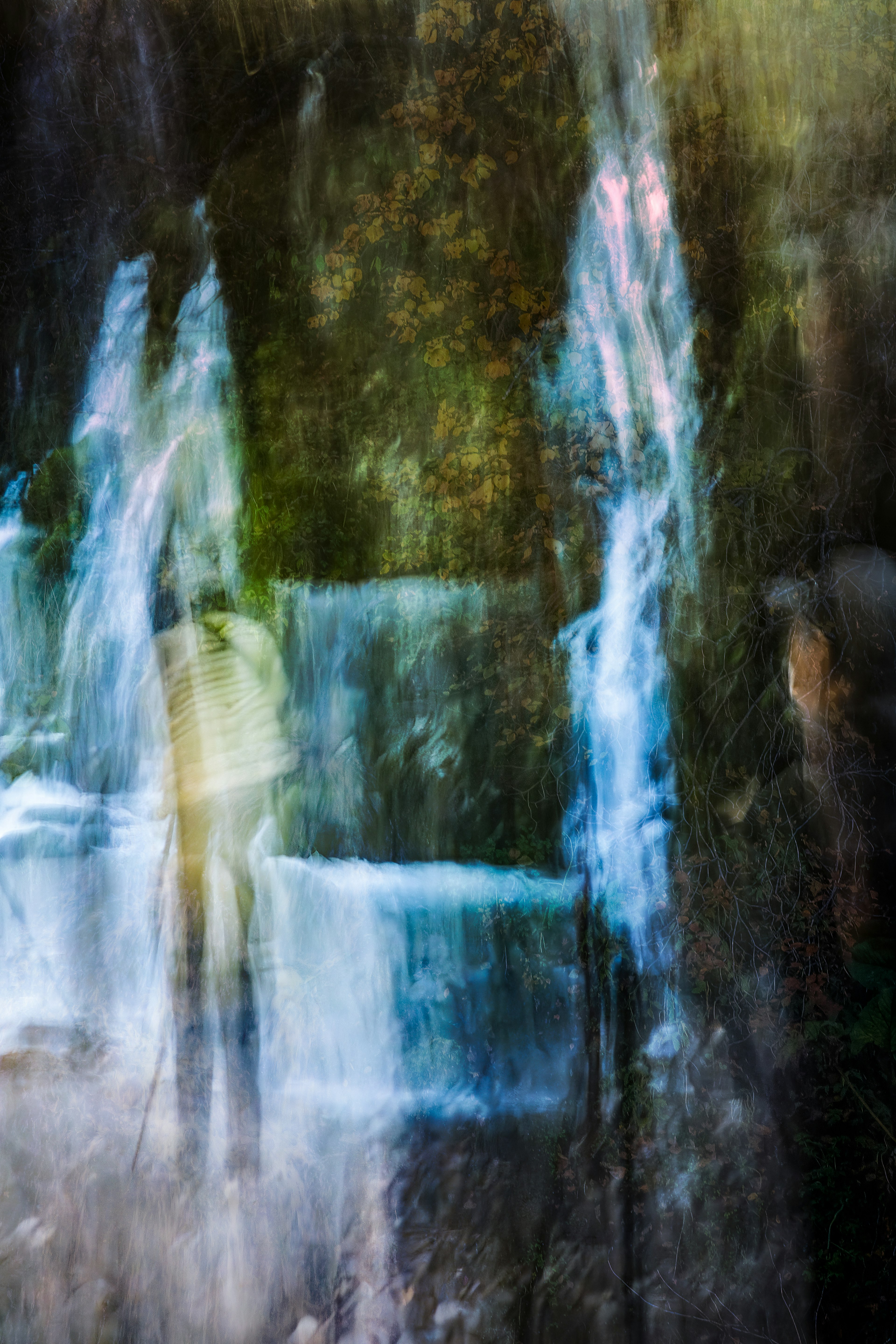 Dreamlike scene of blurred water flow and intertwining colors