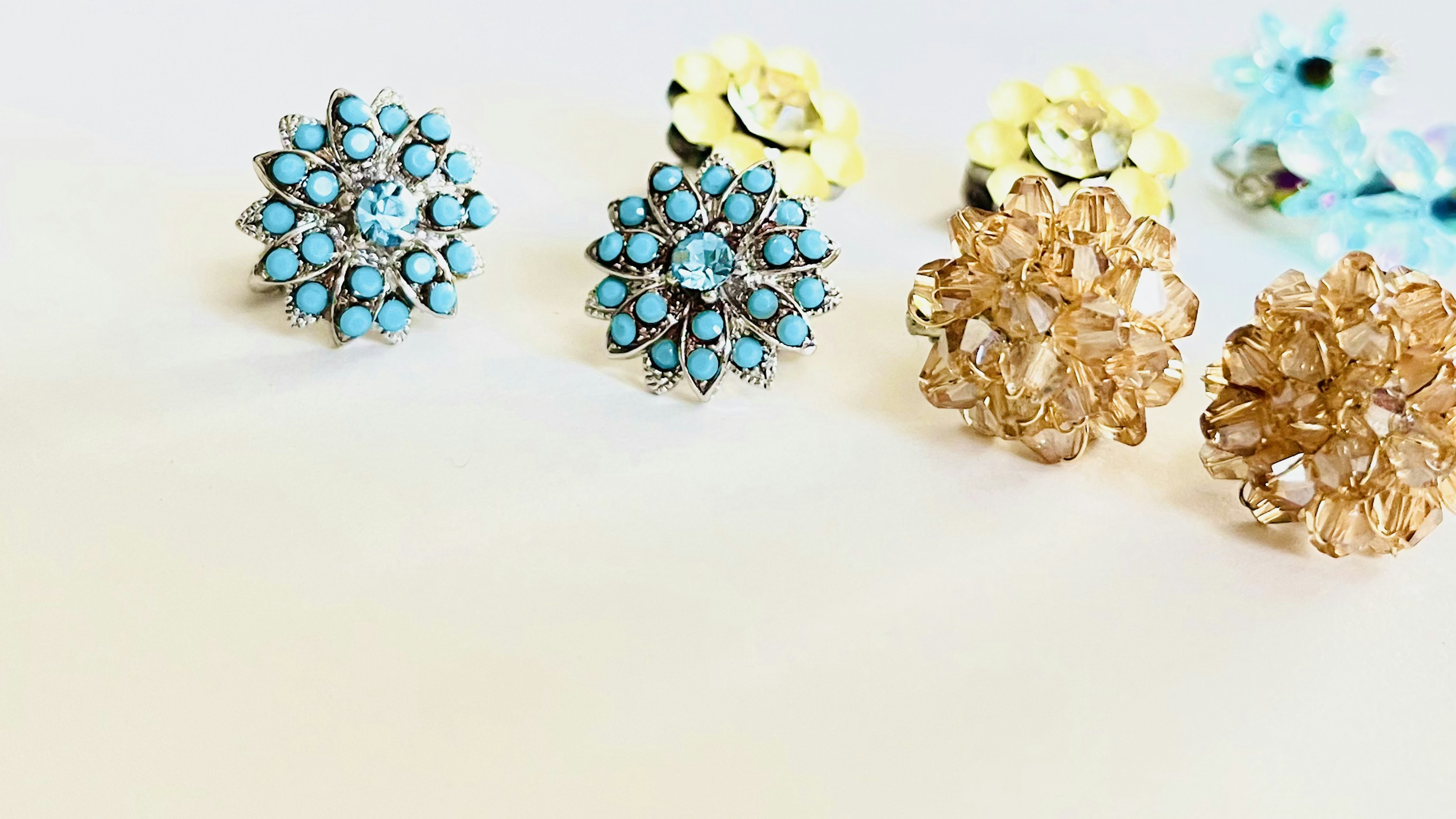 Beautiful collection of earrings featuring blue and yellow gemstones