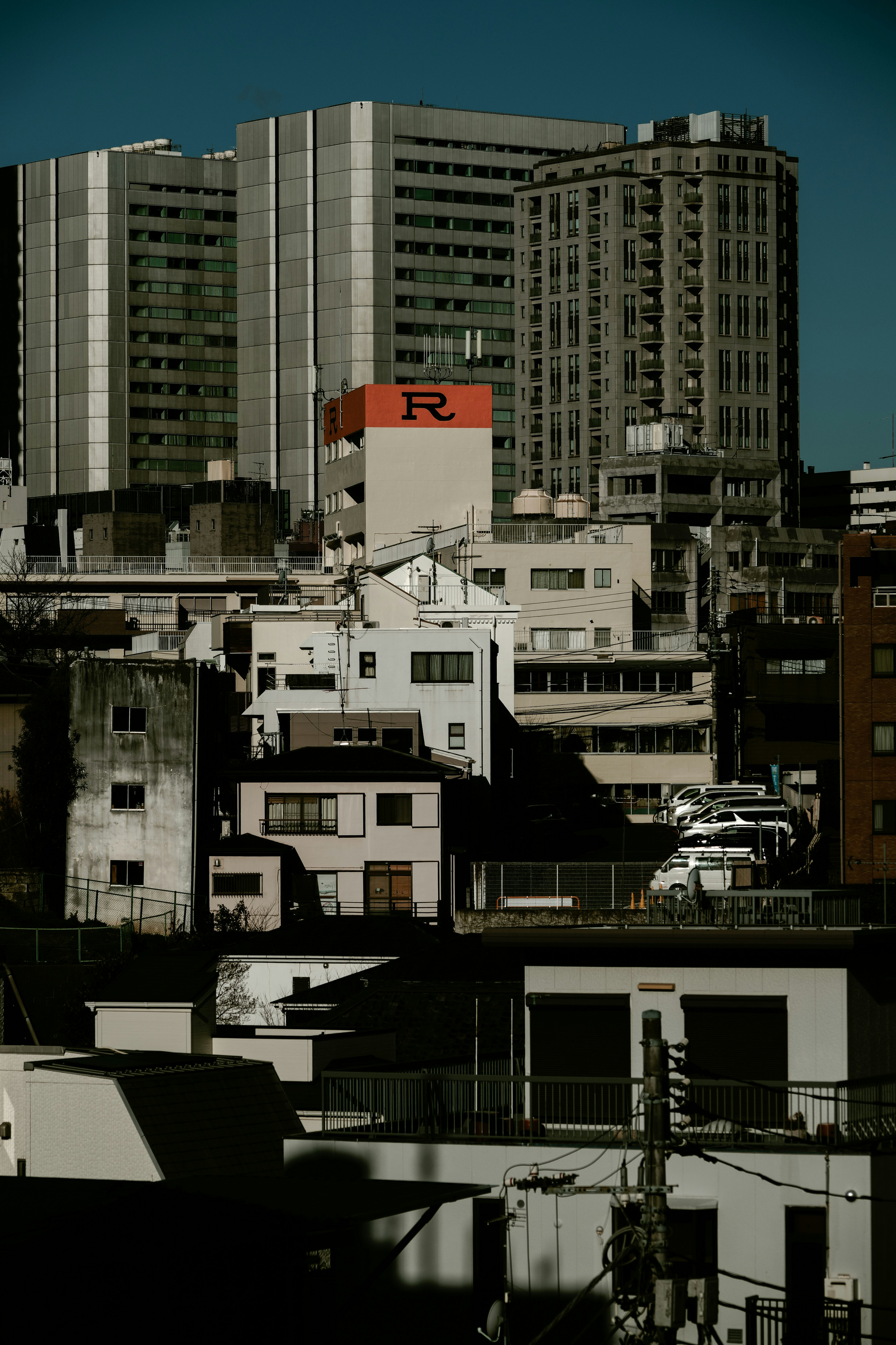 Urban landscape featuring a mix of skyscrapers and residential buildings