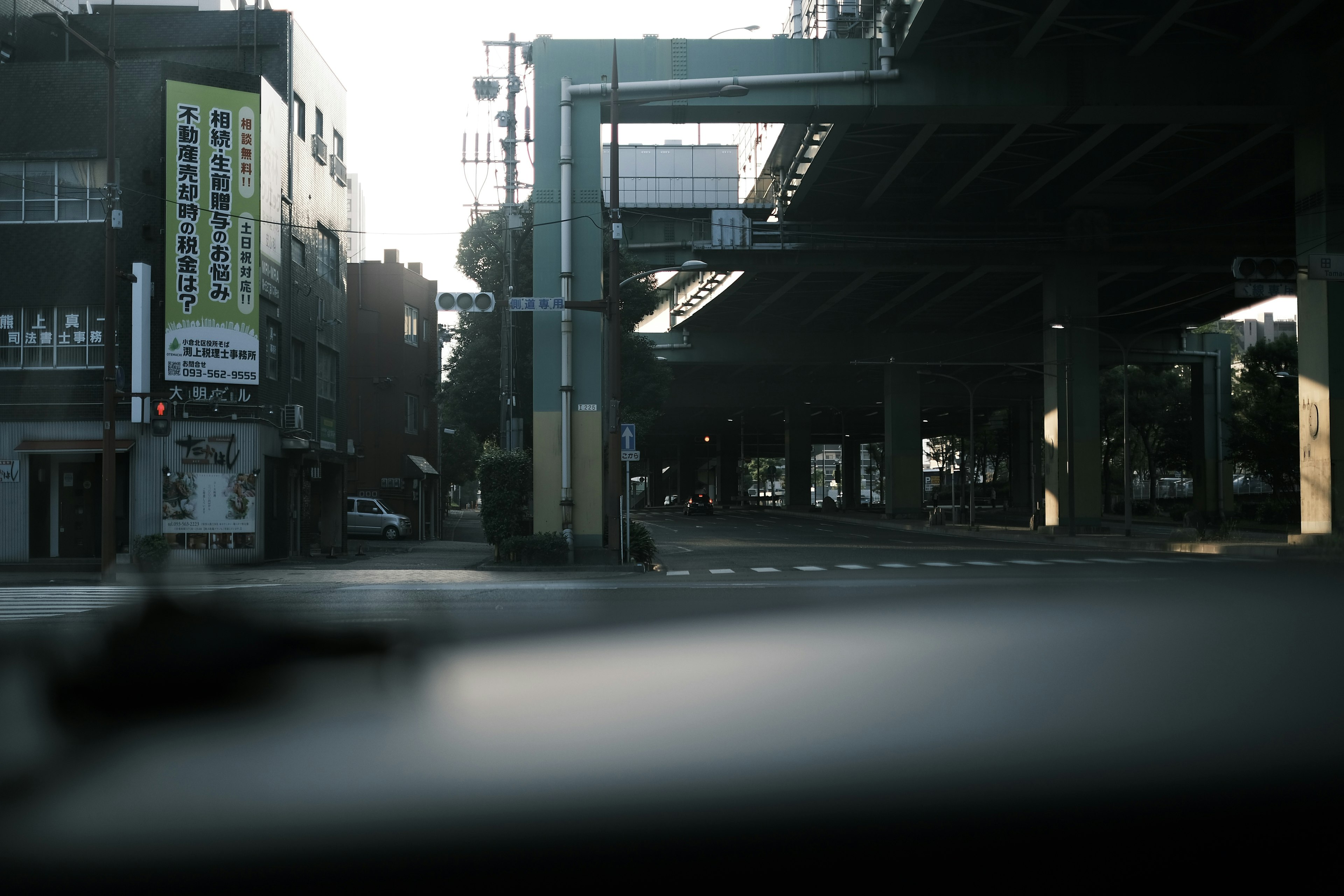 Urban landscape showing a road and an elevated highway