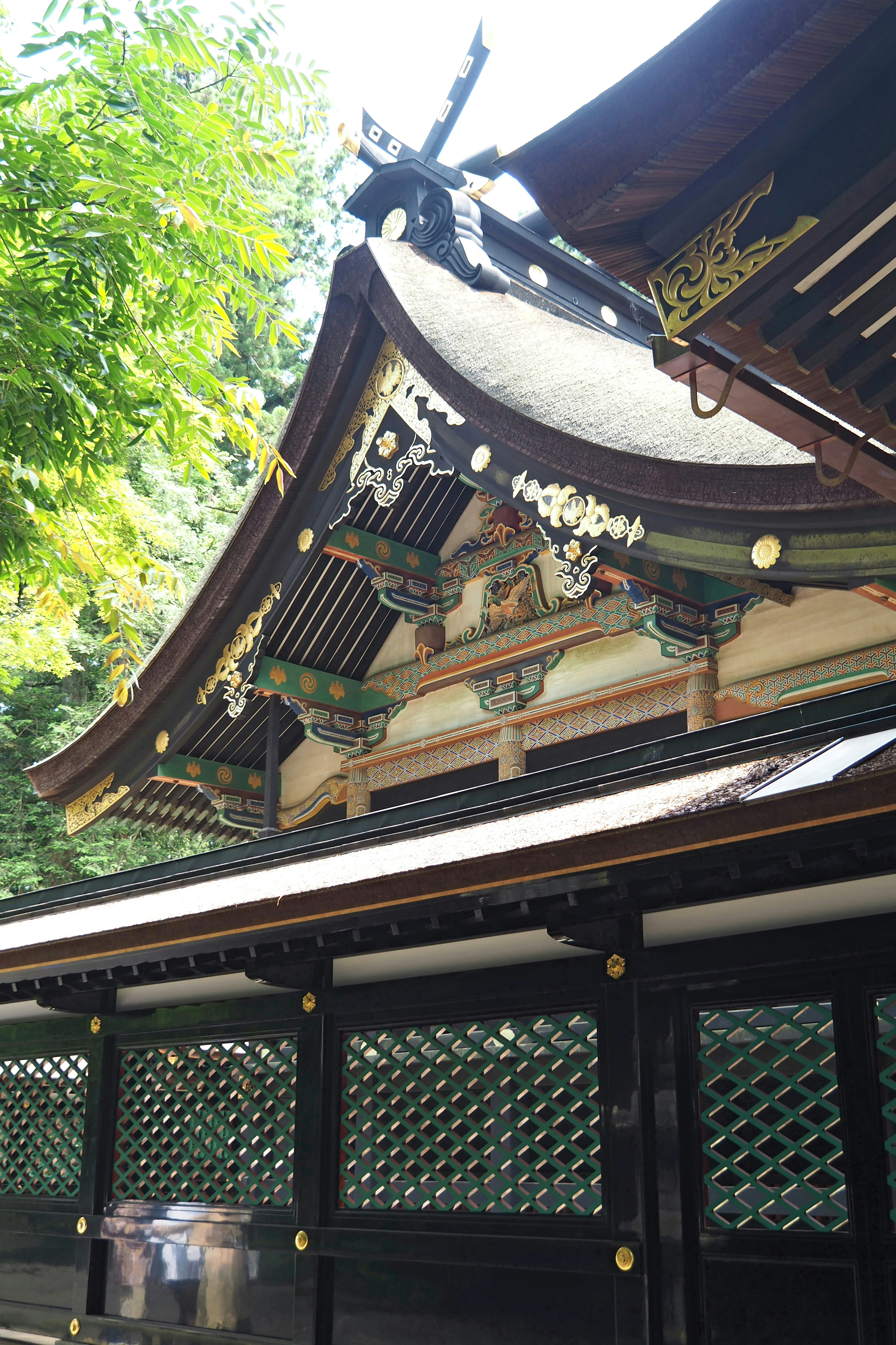 Traditional Japanese shrine roof with intricate decorations