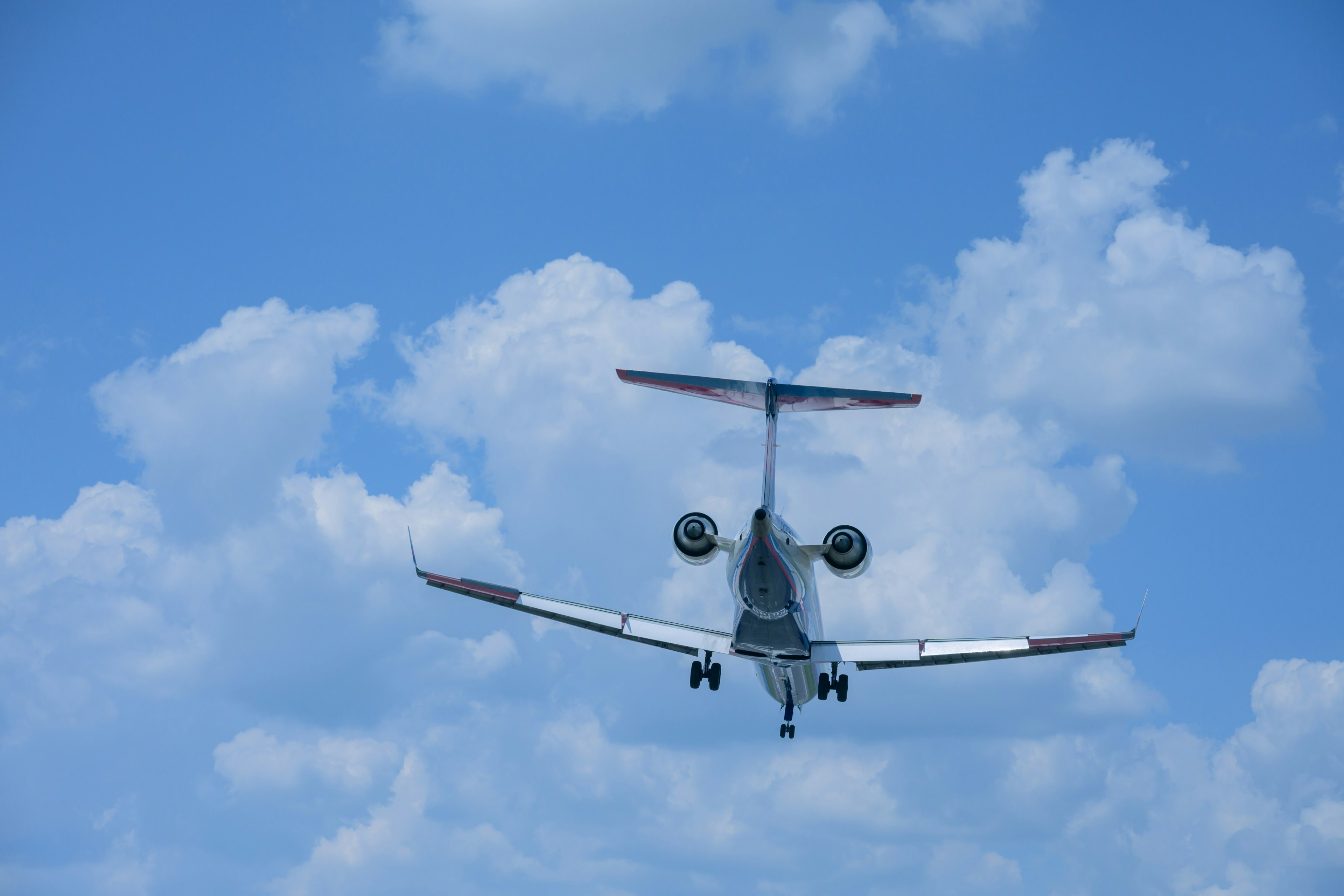 Small jet aircraft flying in the blue sky