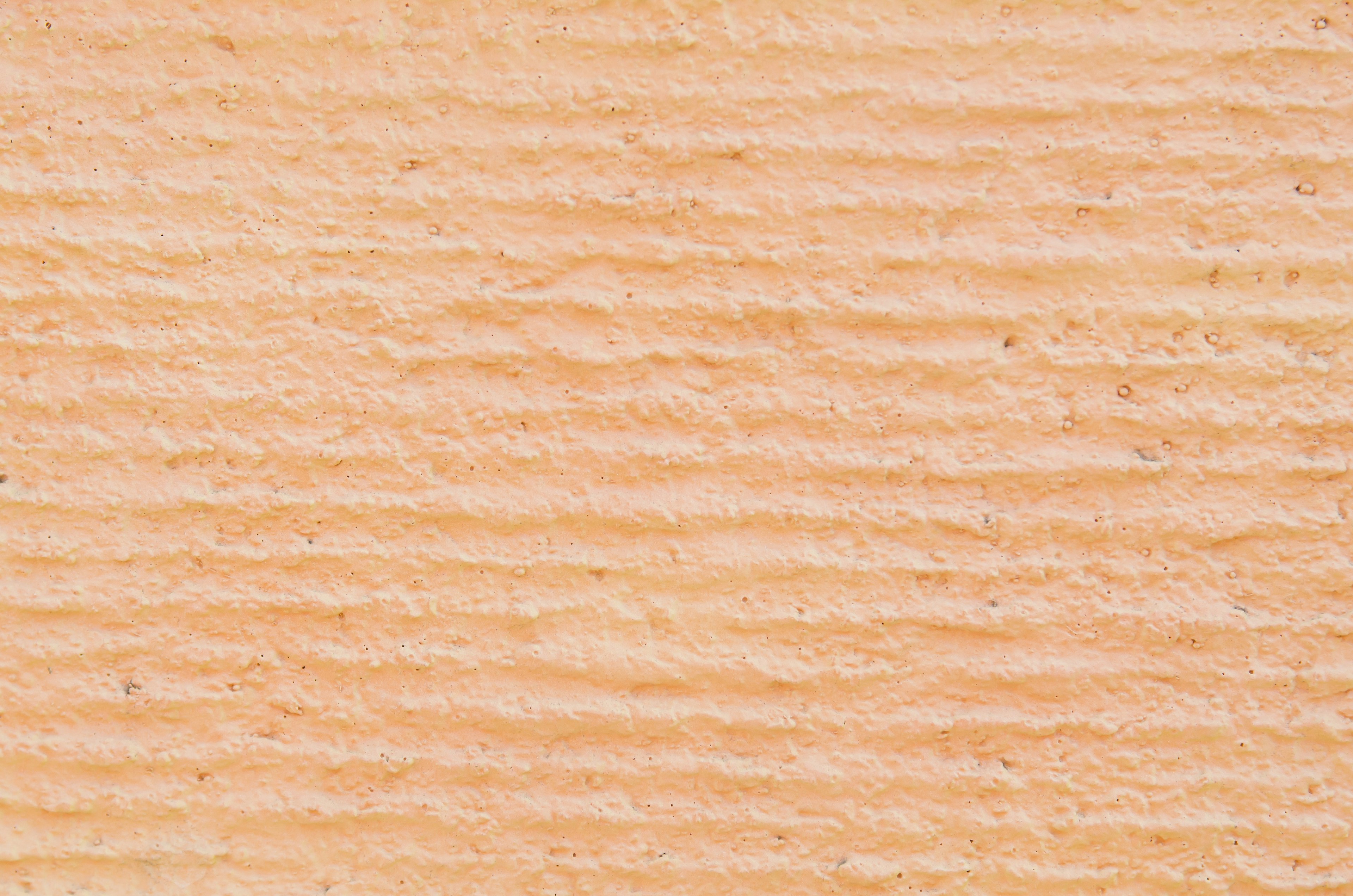 Helle orangefarbene Textur mit feinen Streifen