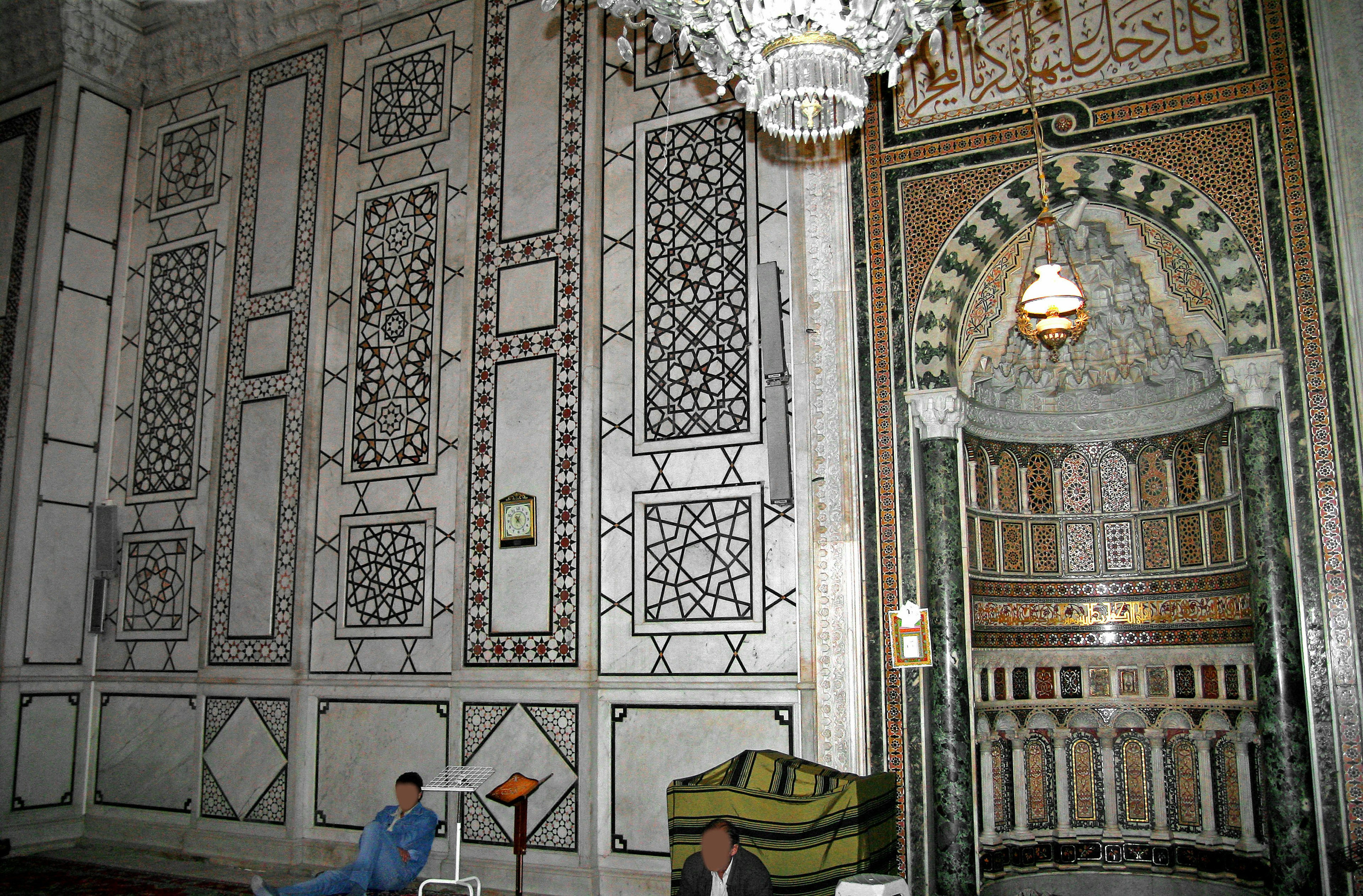 Interior of a room with beautifully decorated walls and an arched entrance