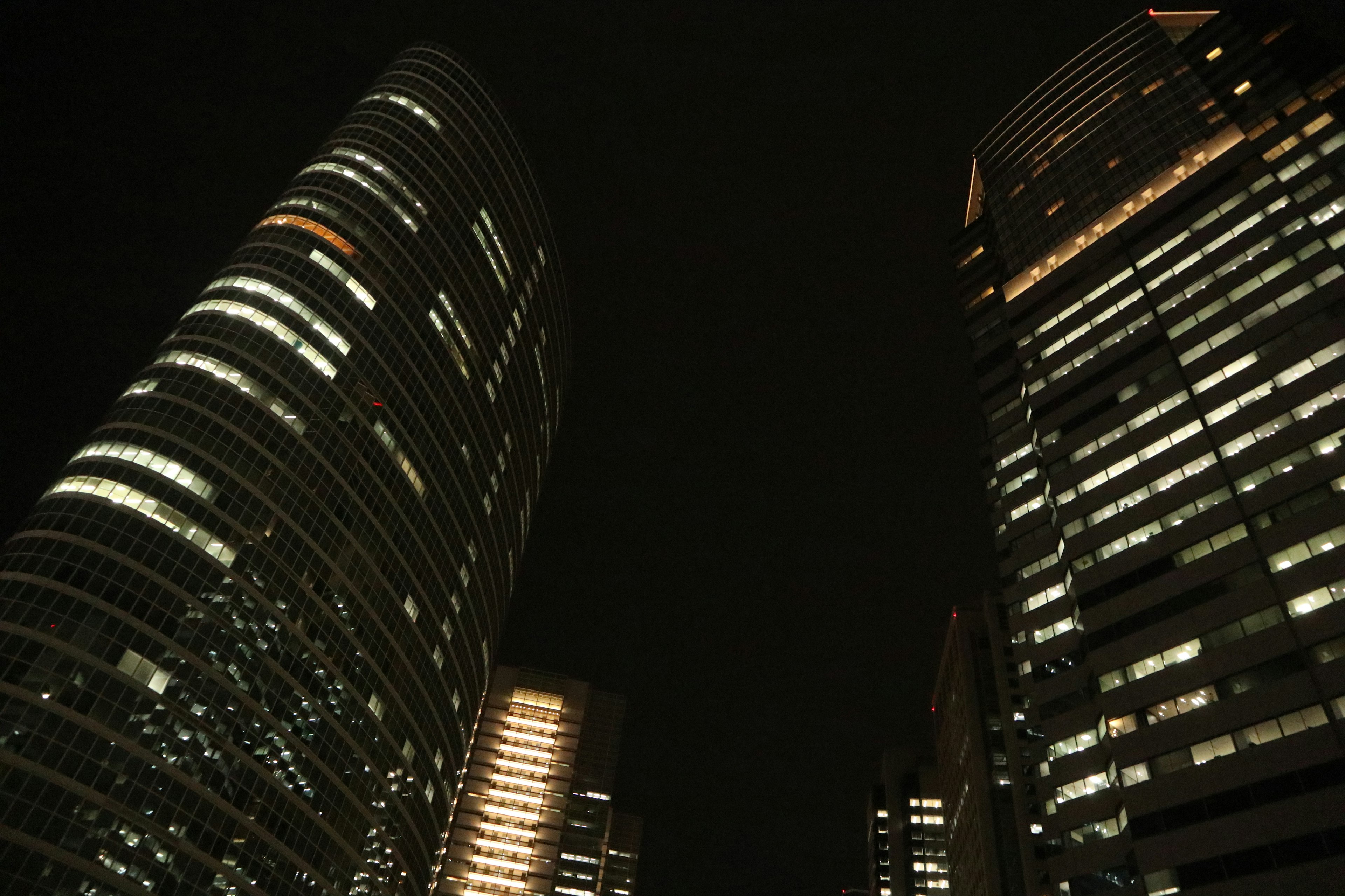 Skyscrapers illuminated at night with glowing windows