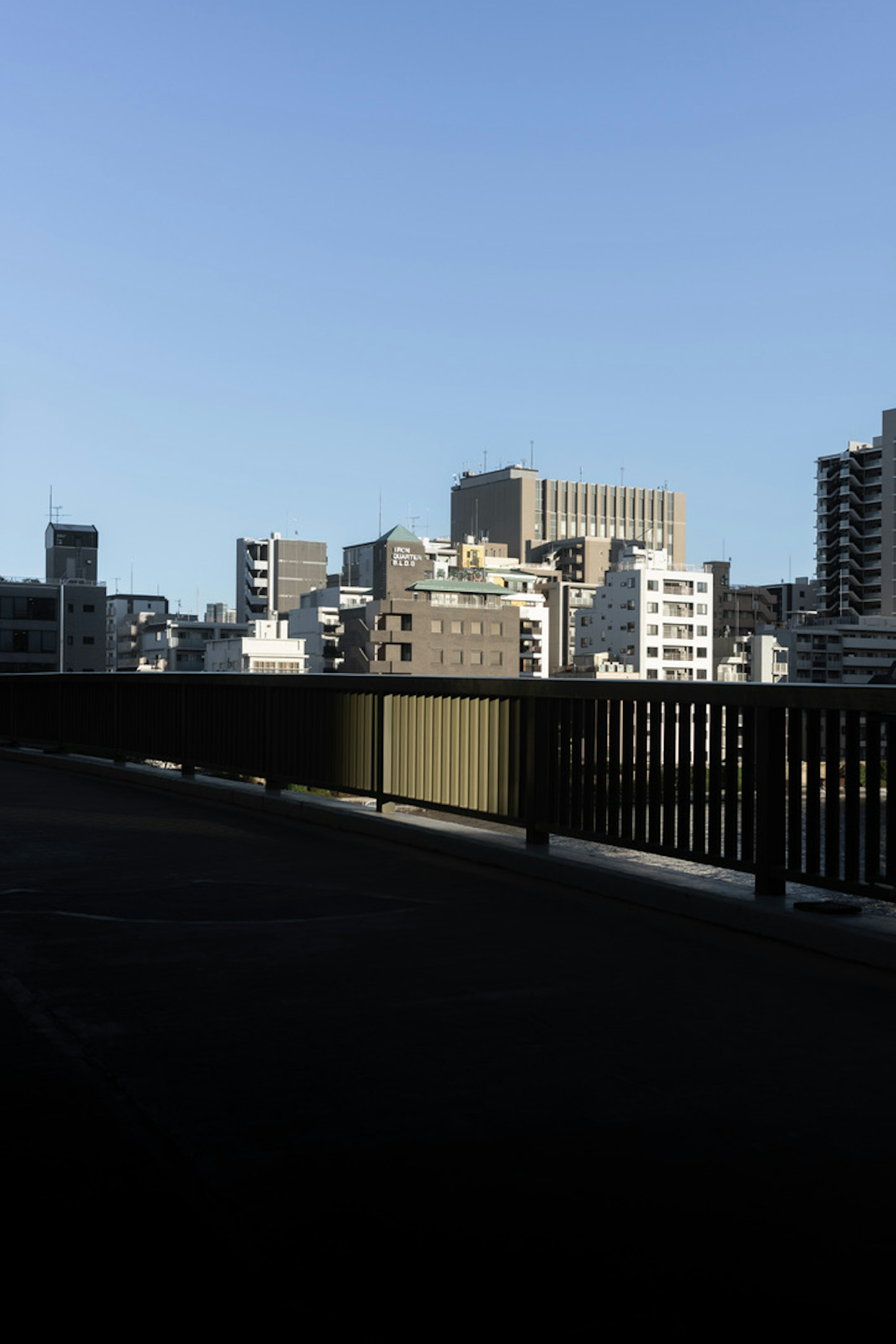 City skyline with high-rise buildings under a clear blue sky