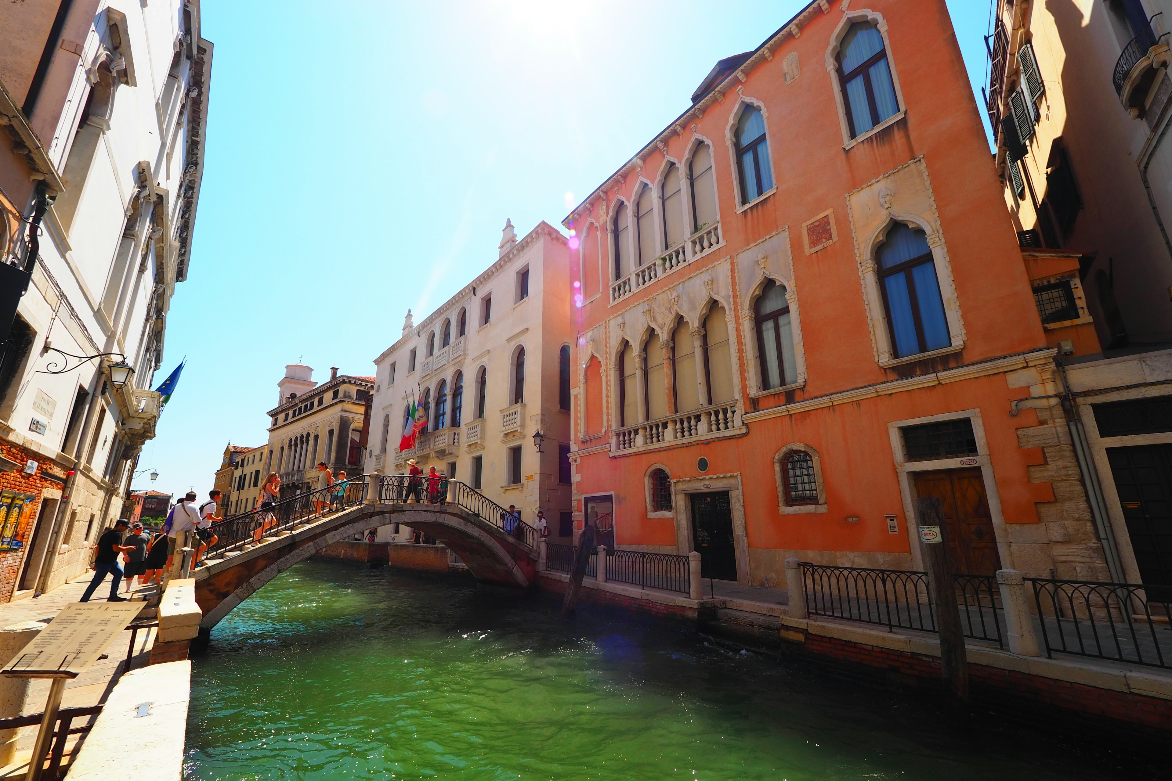 Venice canal with colorful buildings and a bridge