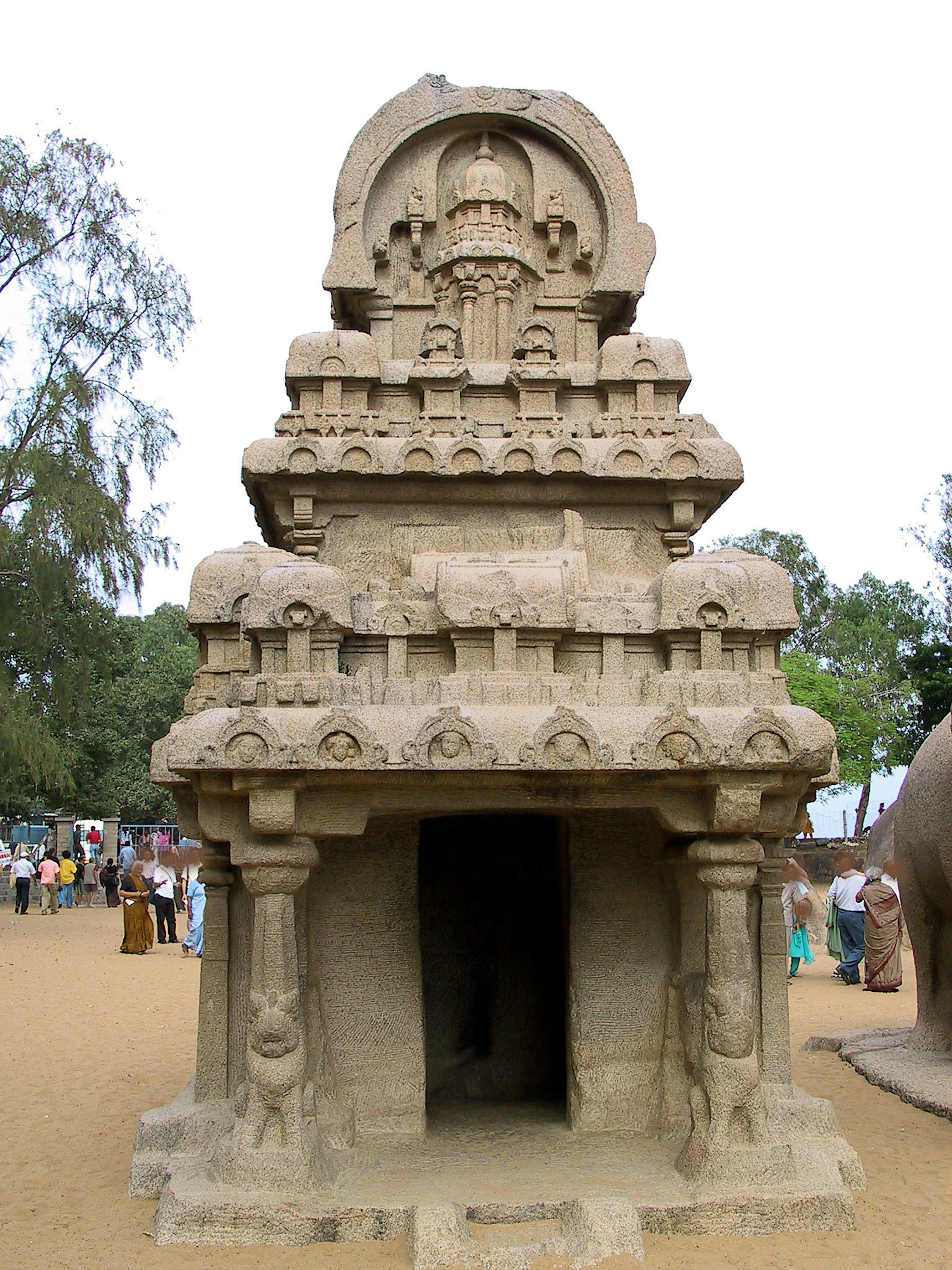 Ancient stone temple structure featuring sculpted roof and entrance