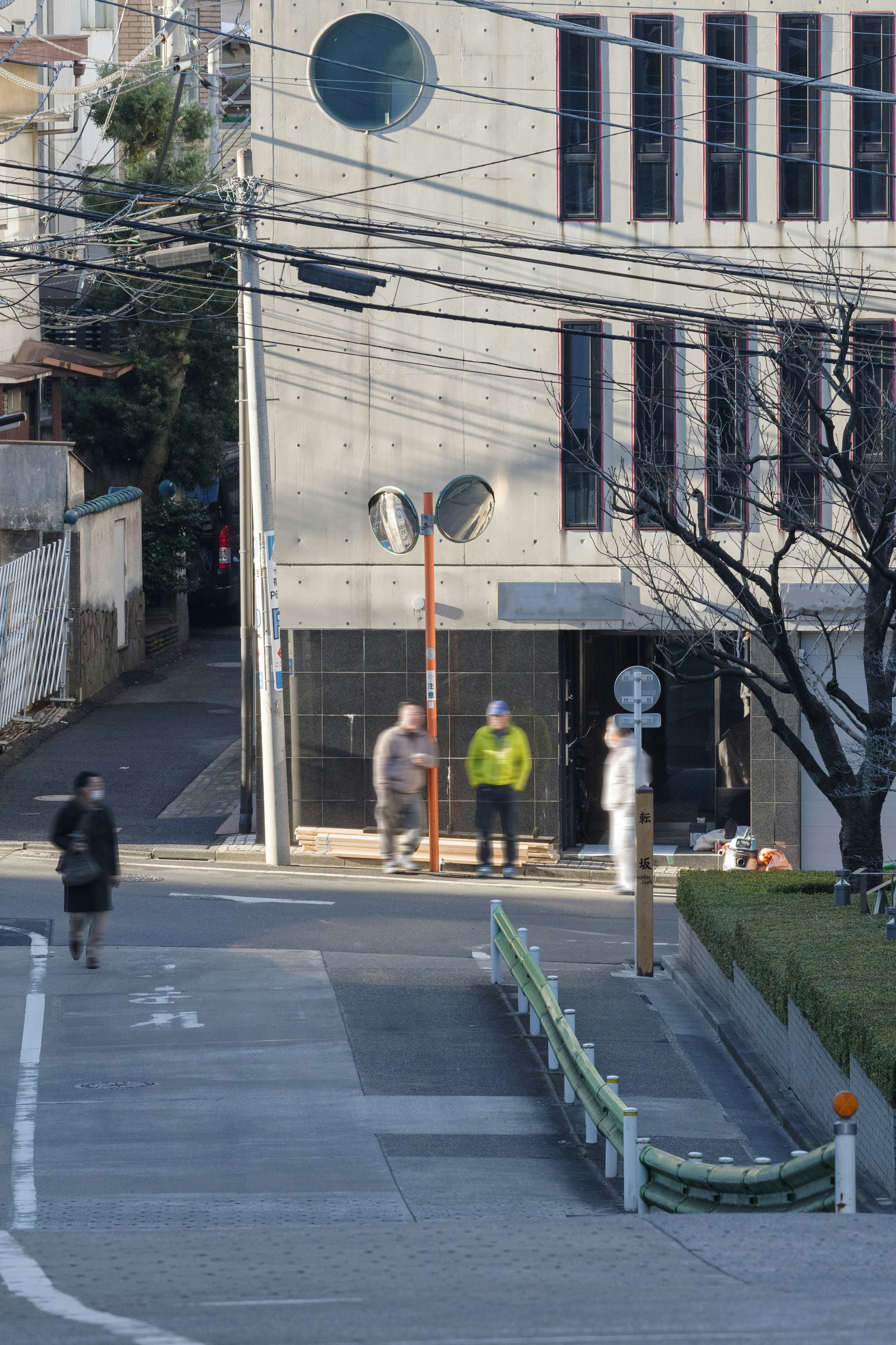 Street scene with people and part of a building