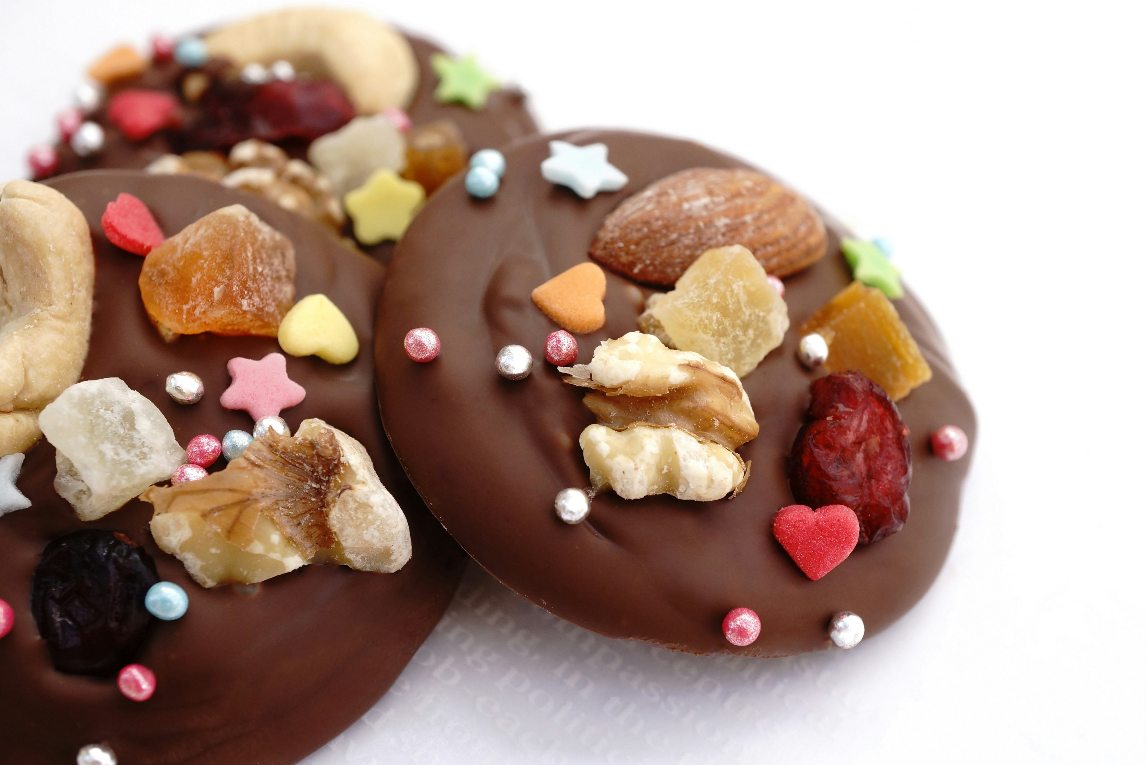 Chocolate cookies topped with nuts and dried fruits