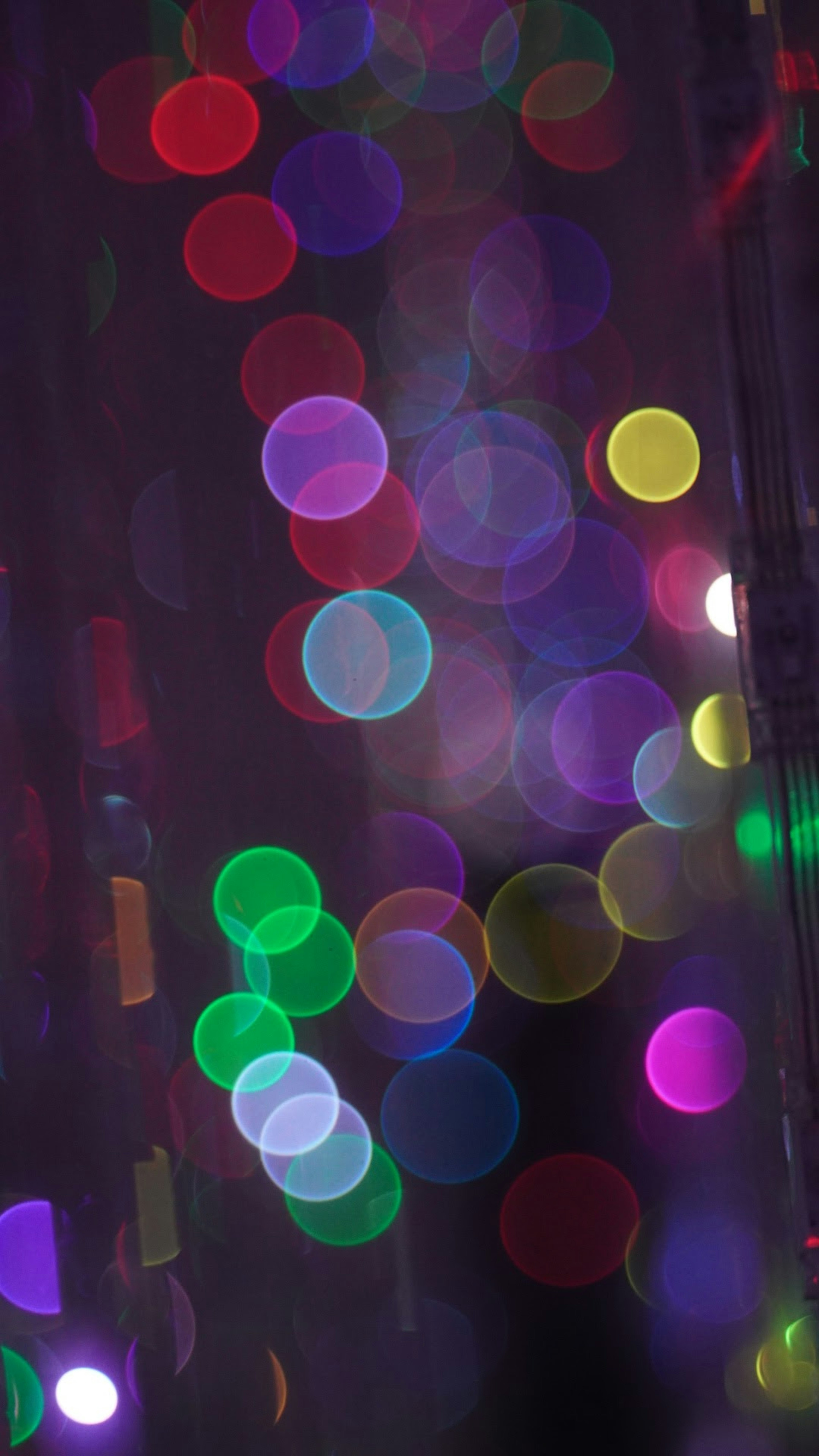 Blurred background with colorful circular lights scattered