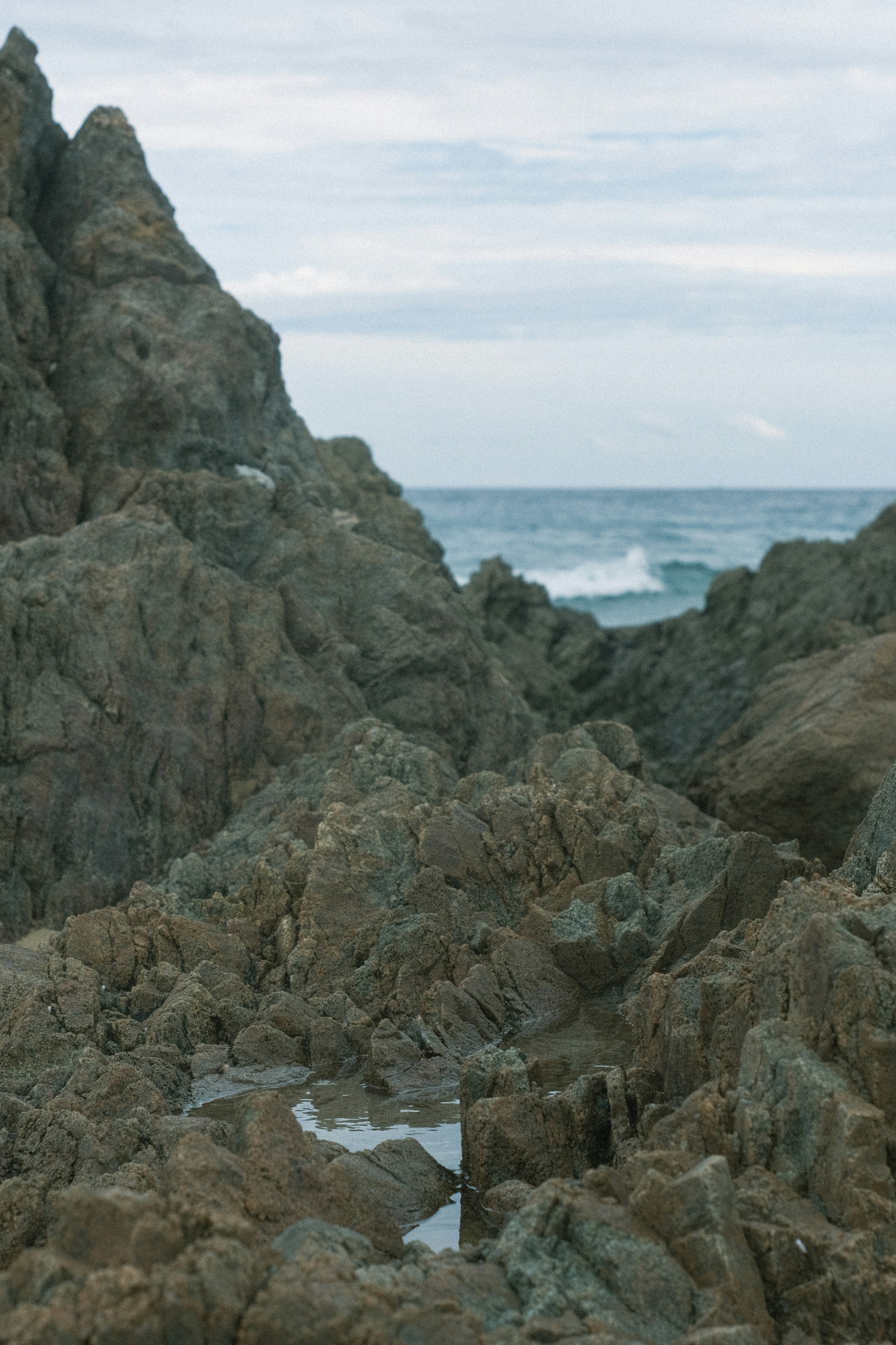 Rugged rocks with crashing waves in the ocean