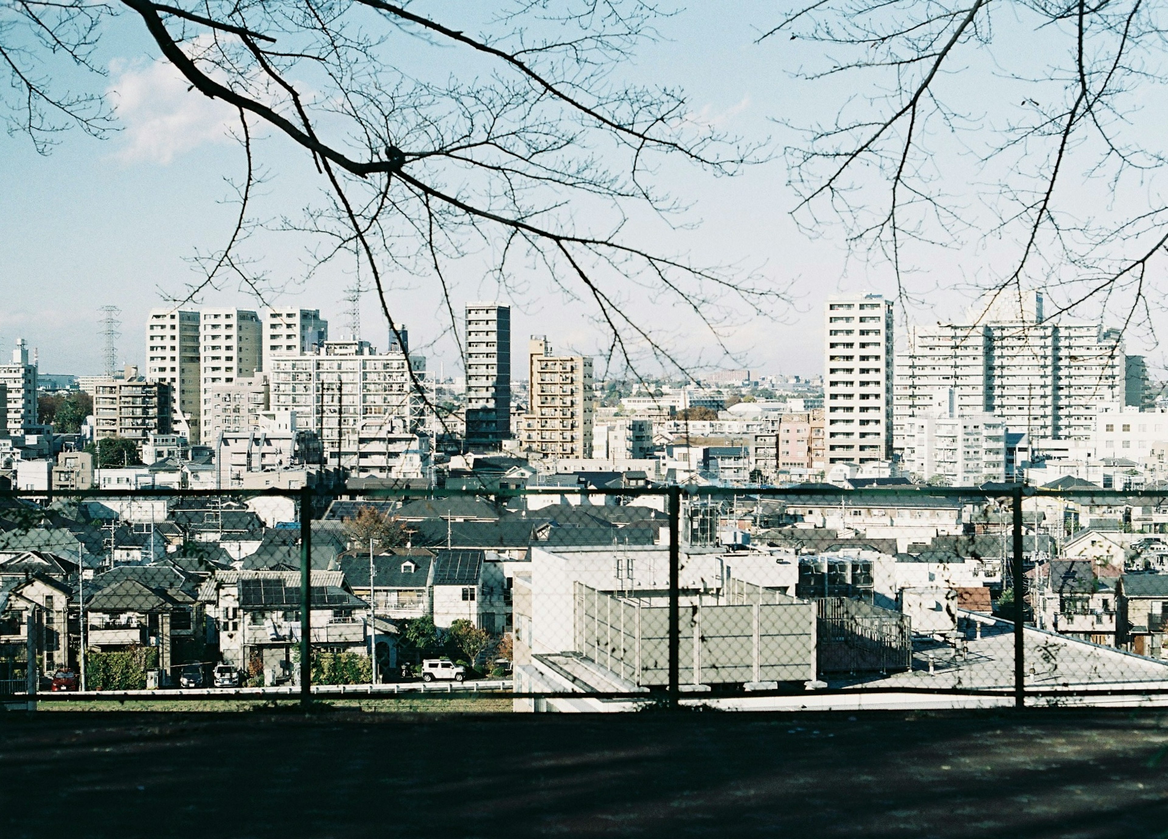 View of a city skyline with various buildings and a clear sky