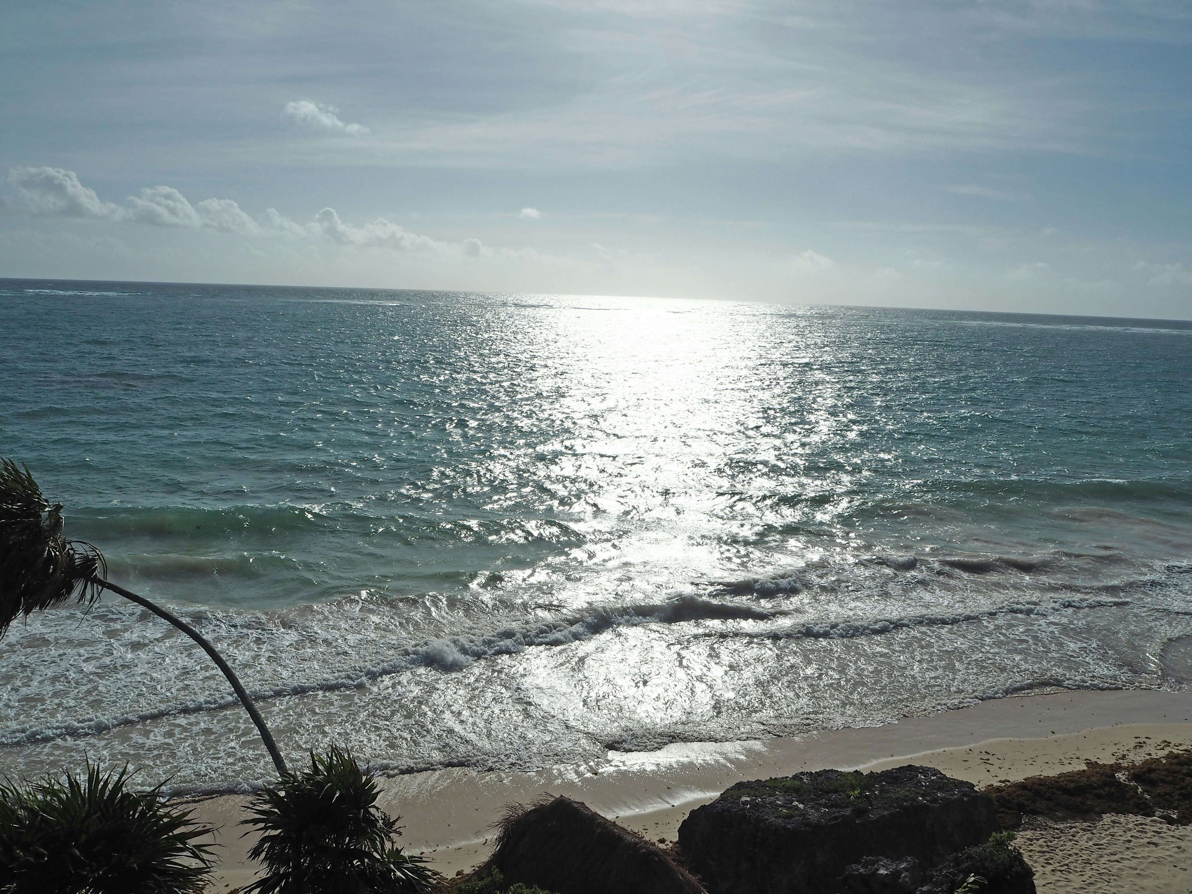 Scenic view of the ocean and sky sunlight reflecting on the water surface