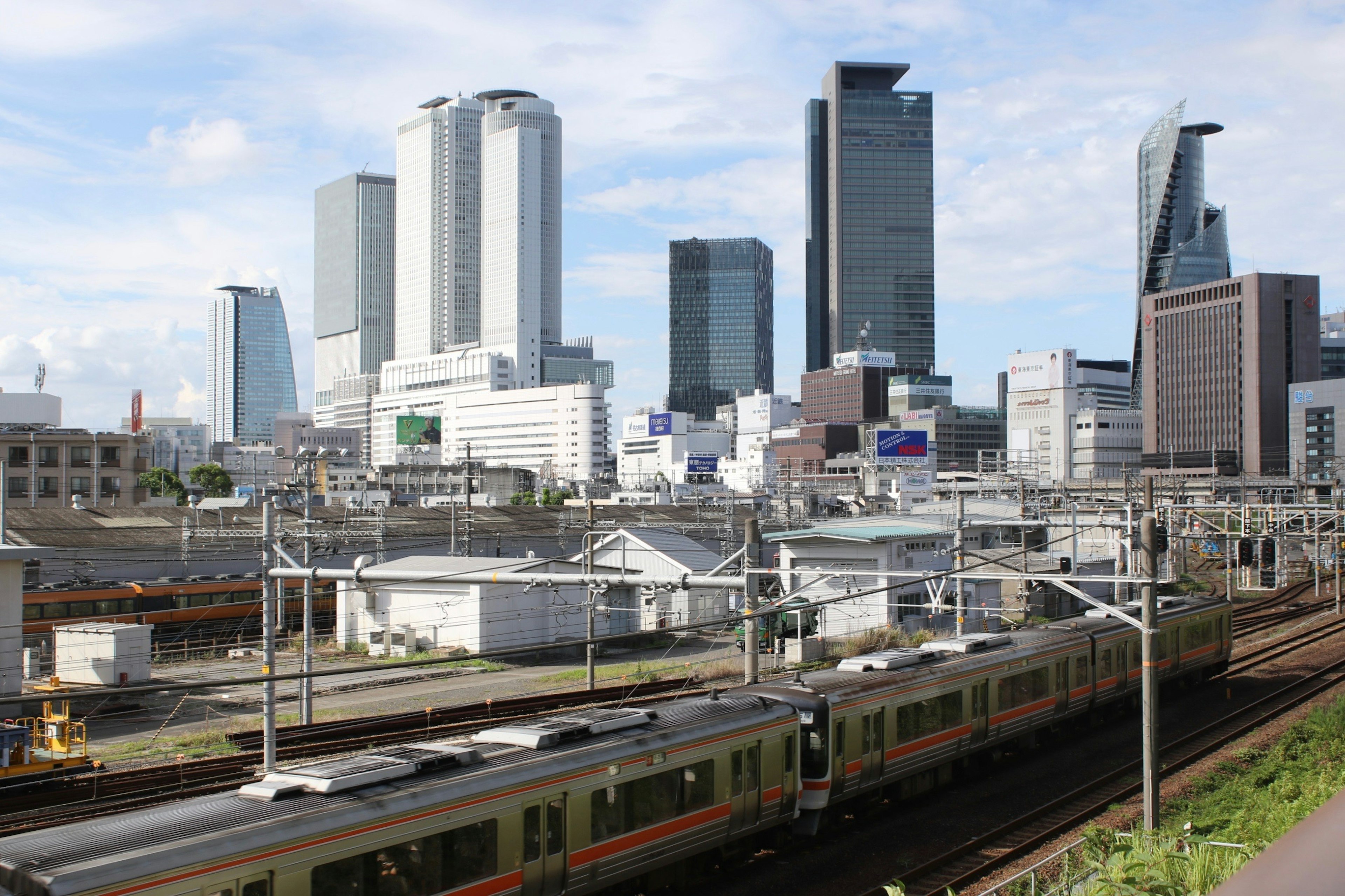 Urban landscape featuring skyscrapers and a train