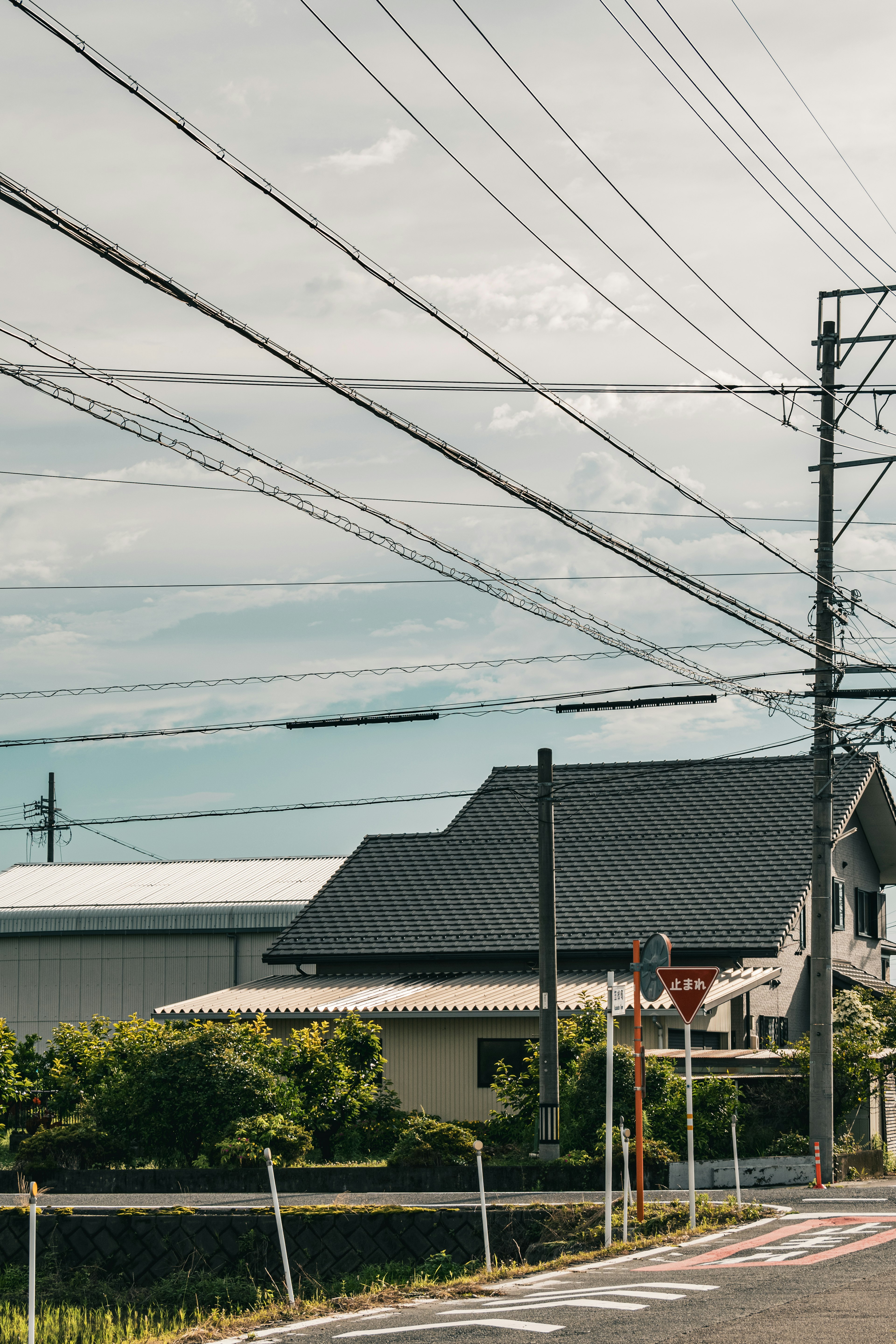 A residential area with power lines under a clear sky