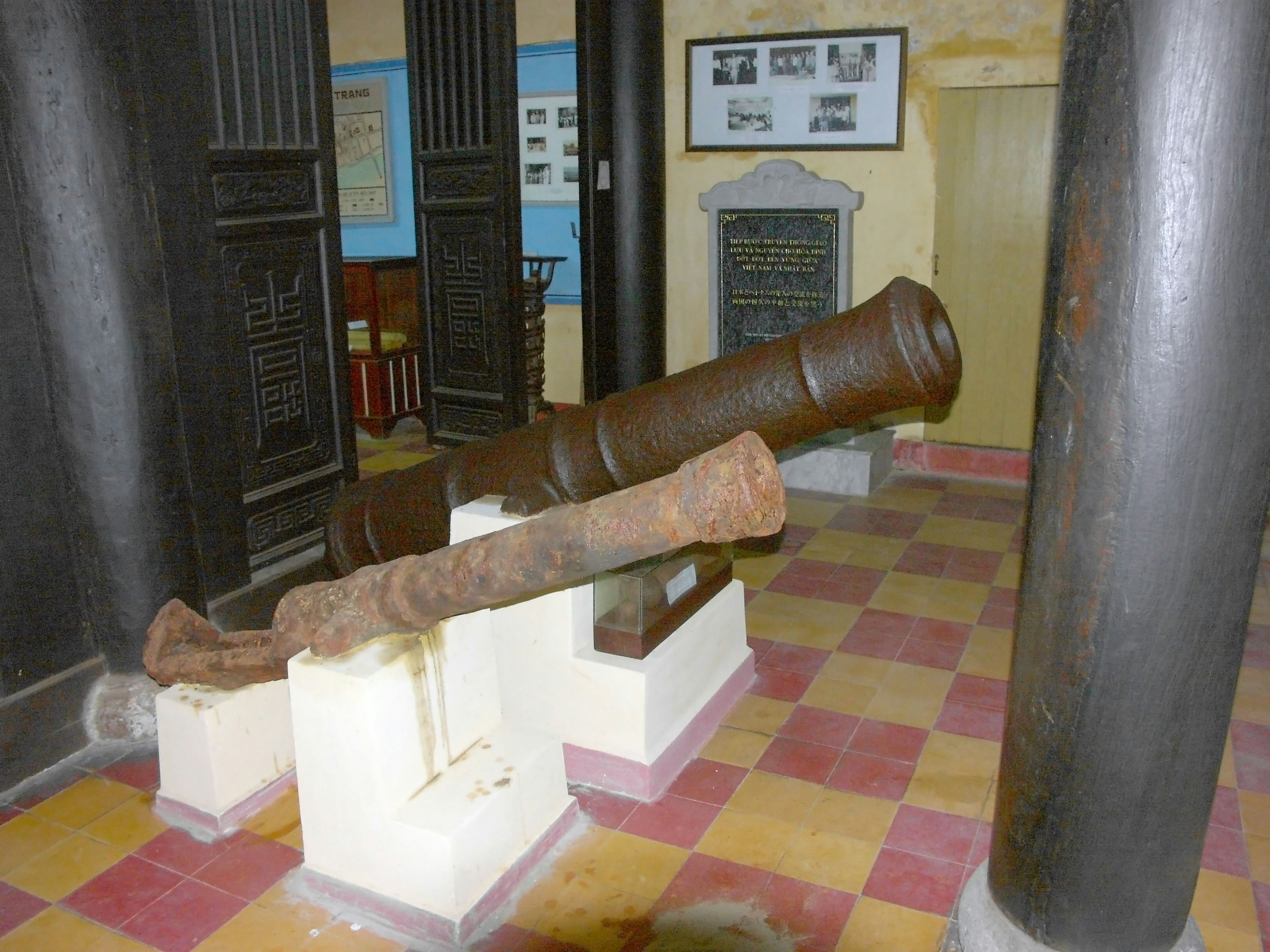 Two old cannons displayed in a museum setting