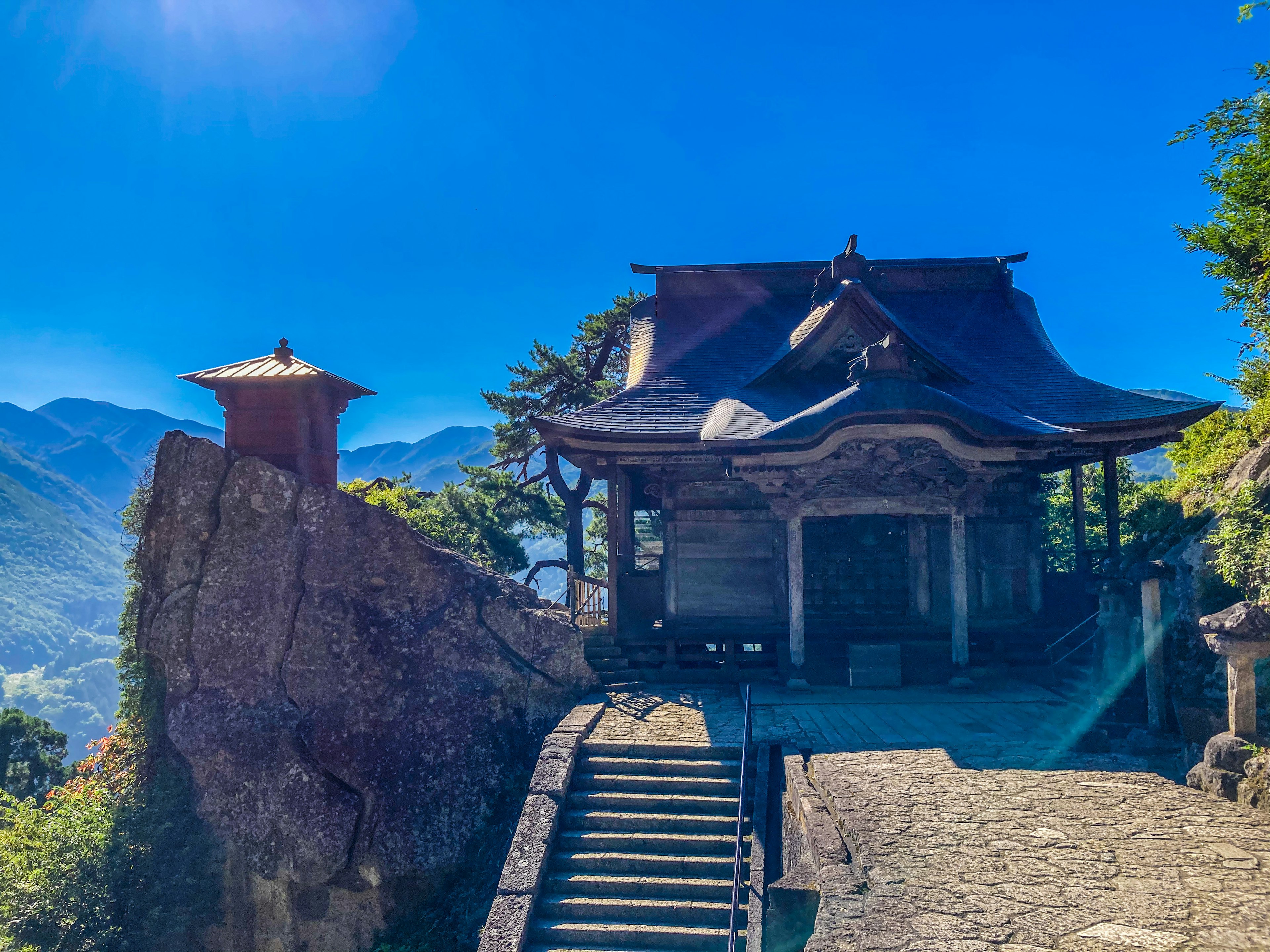 Scenic view of an ancient temple nestled in the mountains