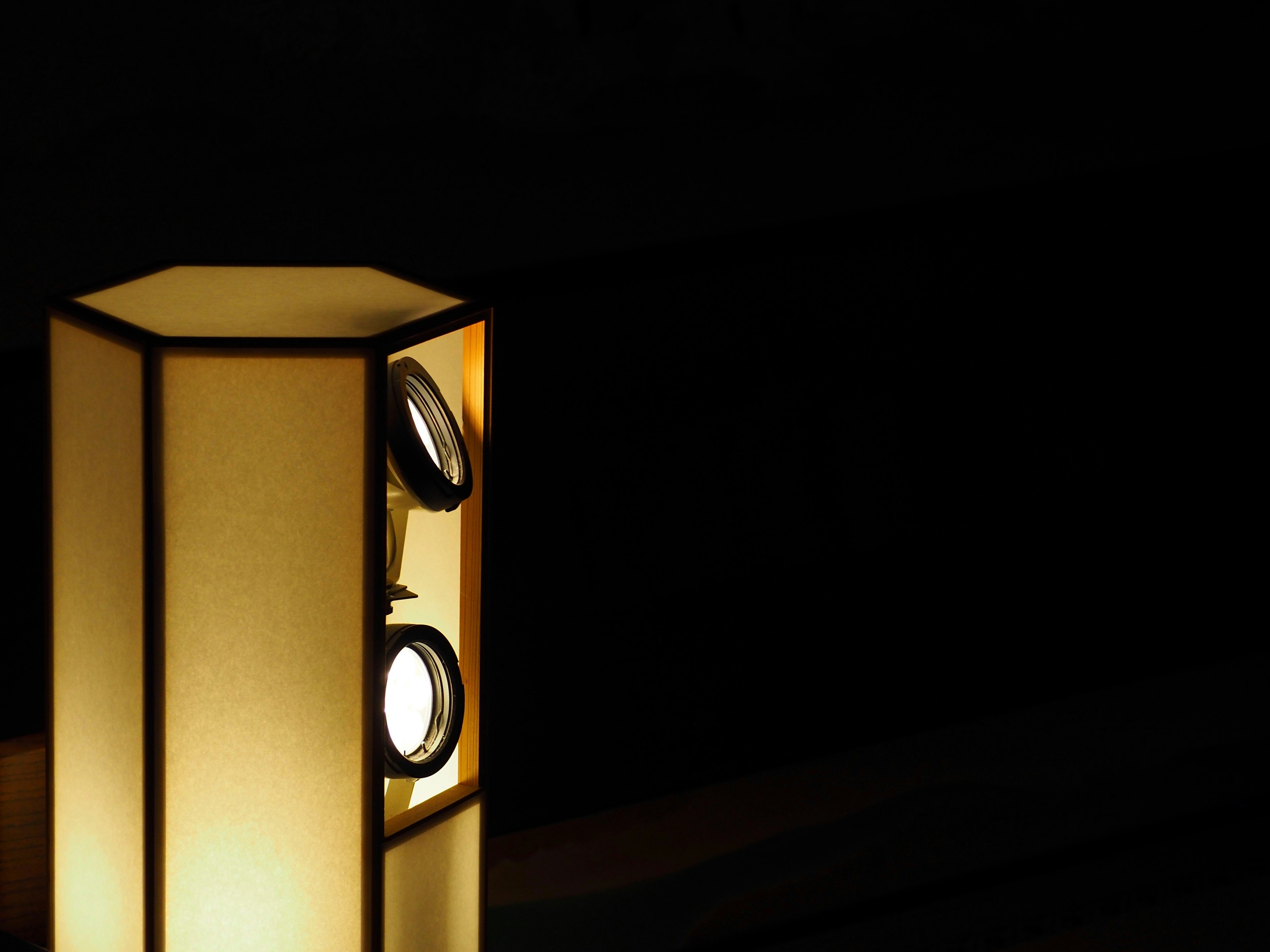 Japanese-style lamp stands in a dark background