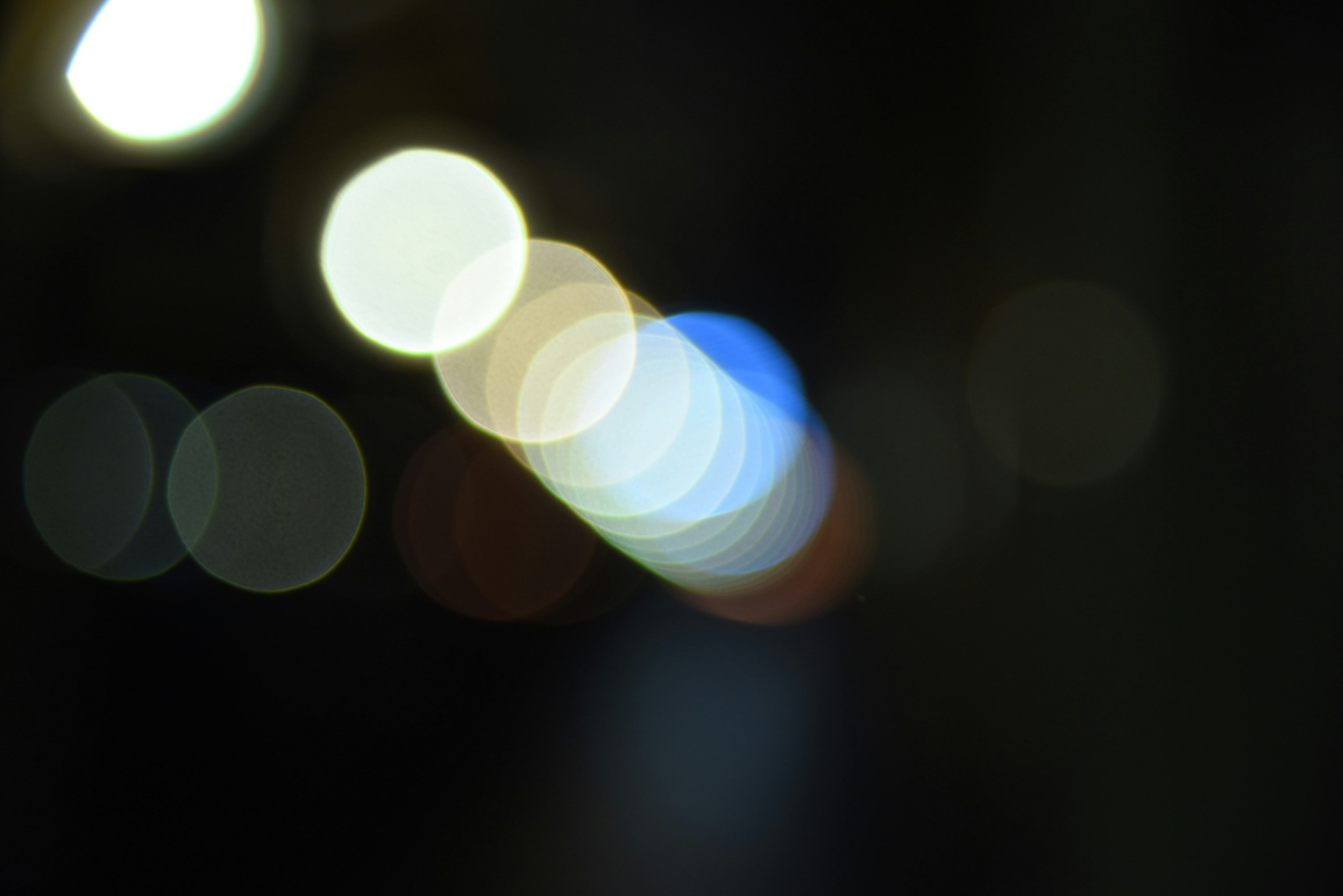 Blurred light spots and colorful circles in a night scene