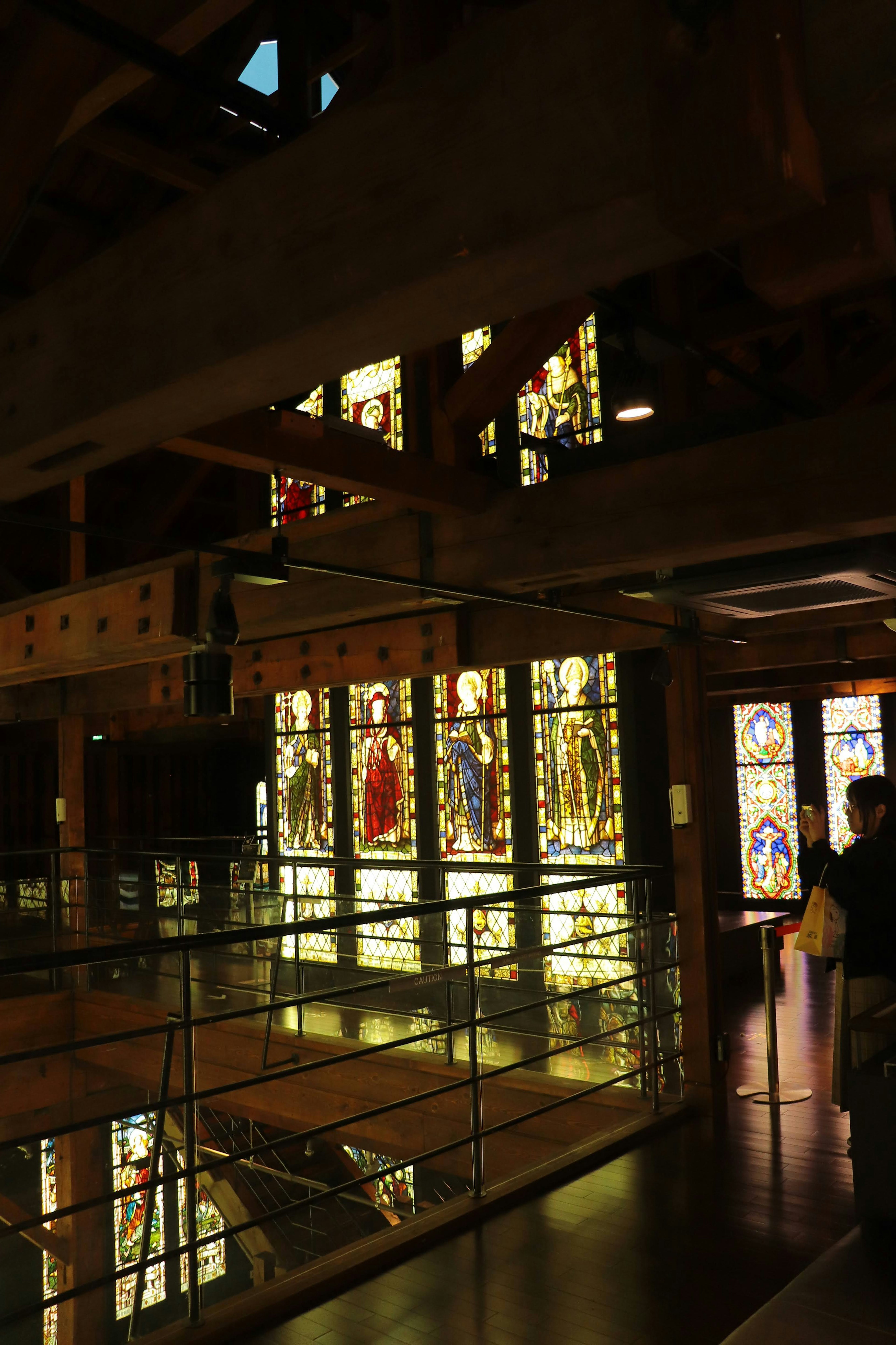 Interior view of a building featuring beautiful stained glass windows