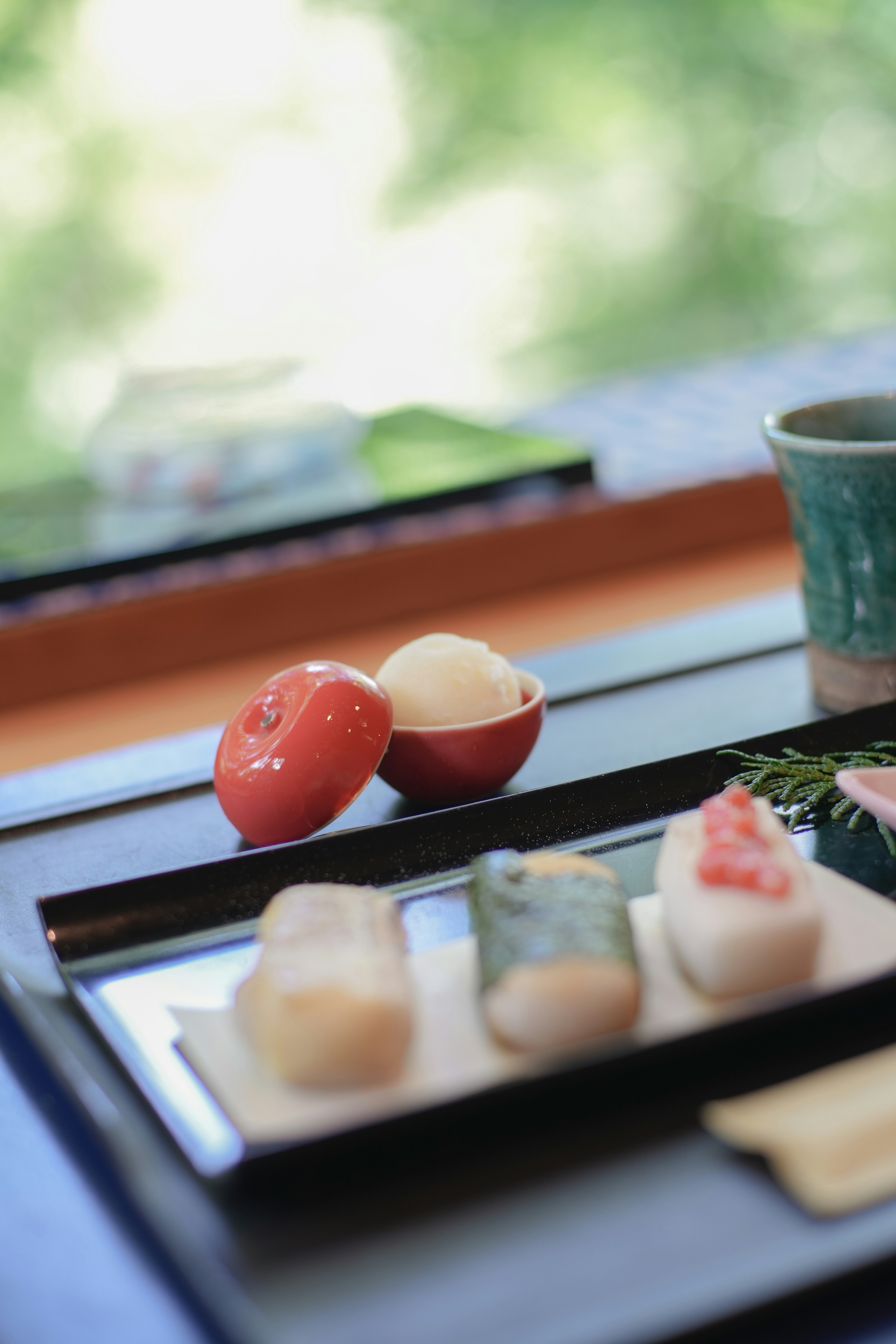 A beautiful sushi plate with a green background dining scene