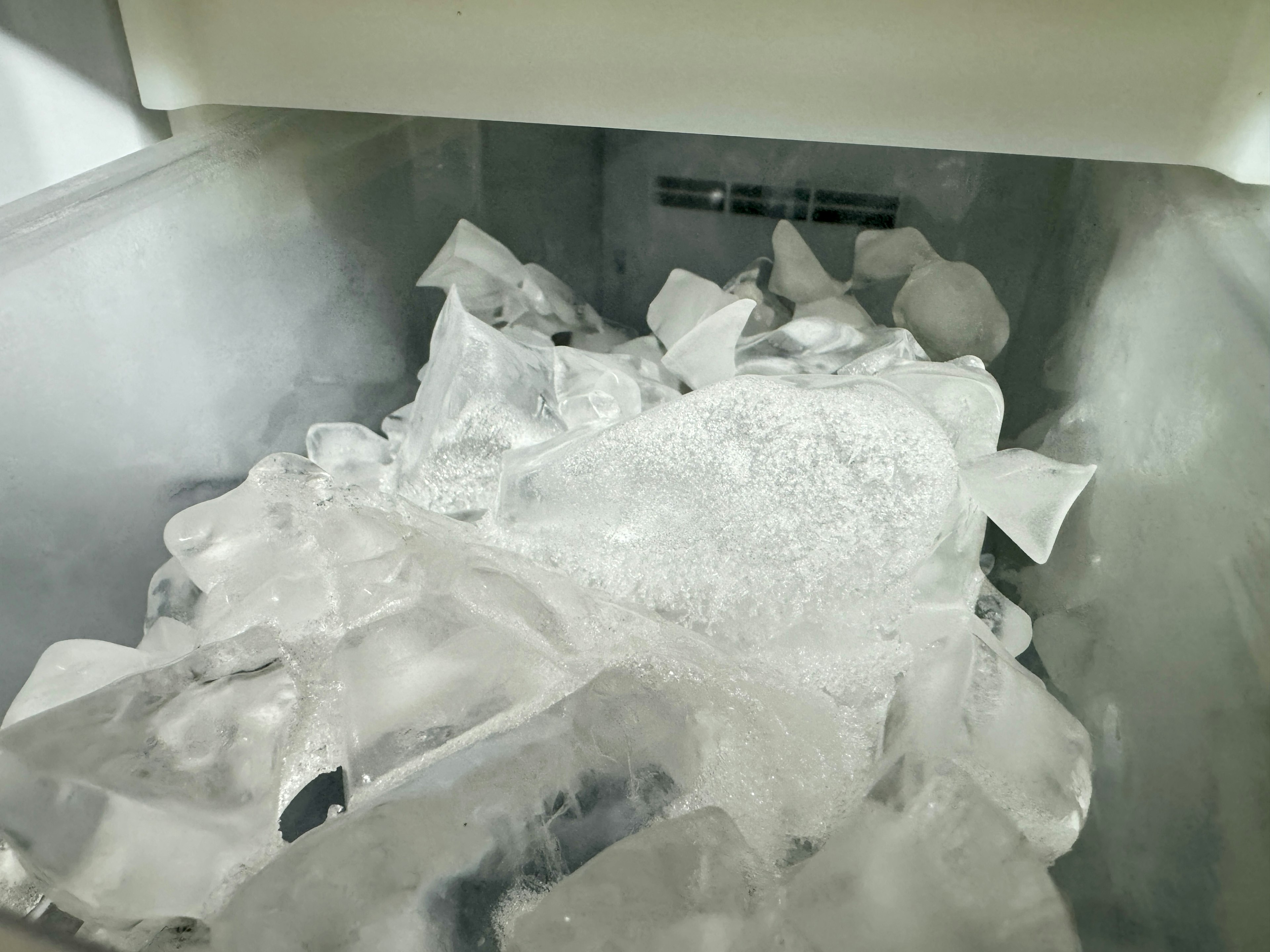 A pile of ice cubes in a freezer