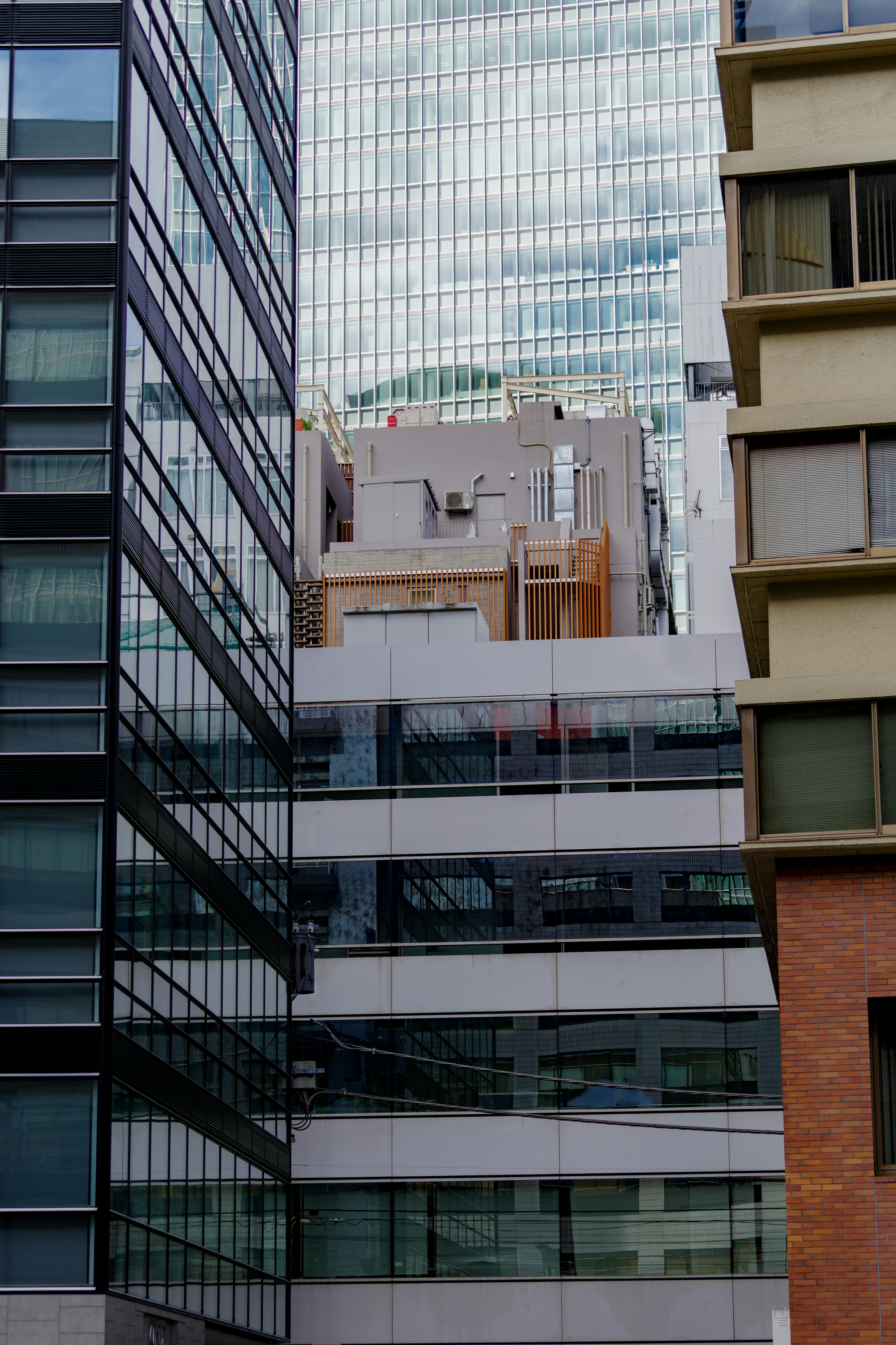 Buildings viewed between skyscrapers showcasing modern architecture