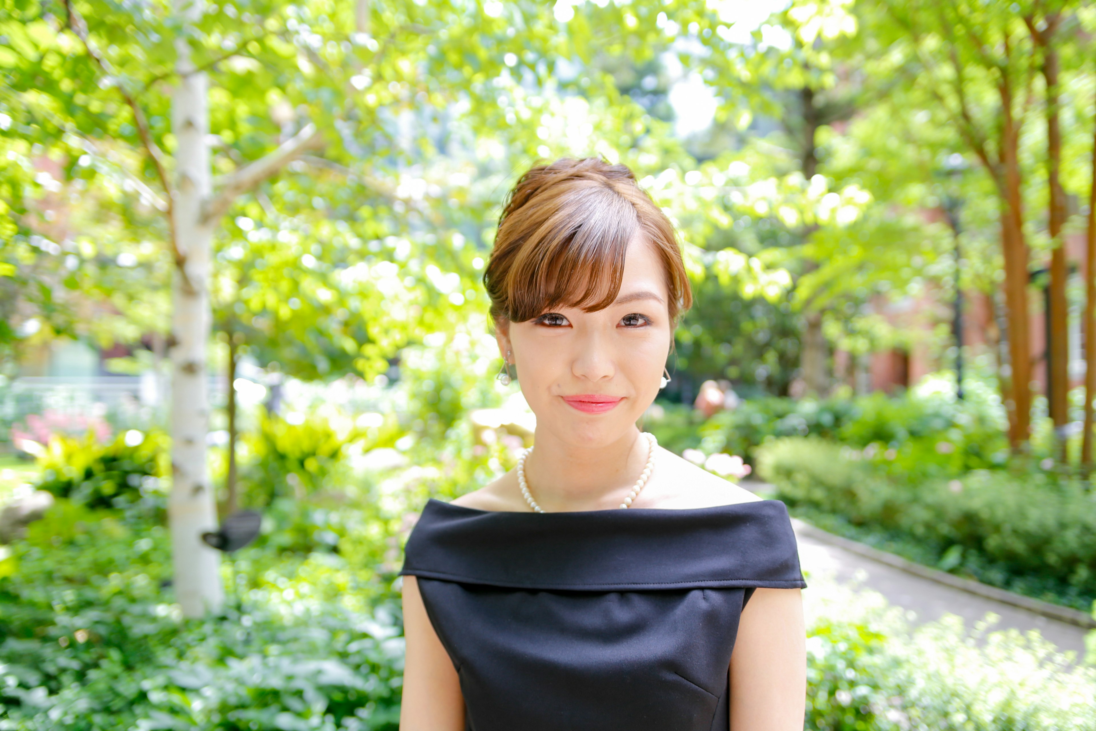 Portrait of a woman smiling in a green background