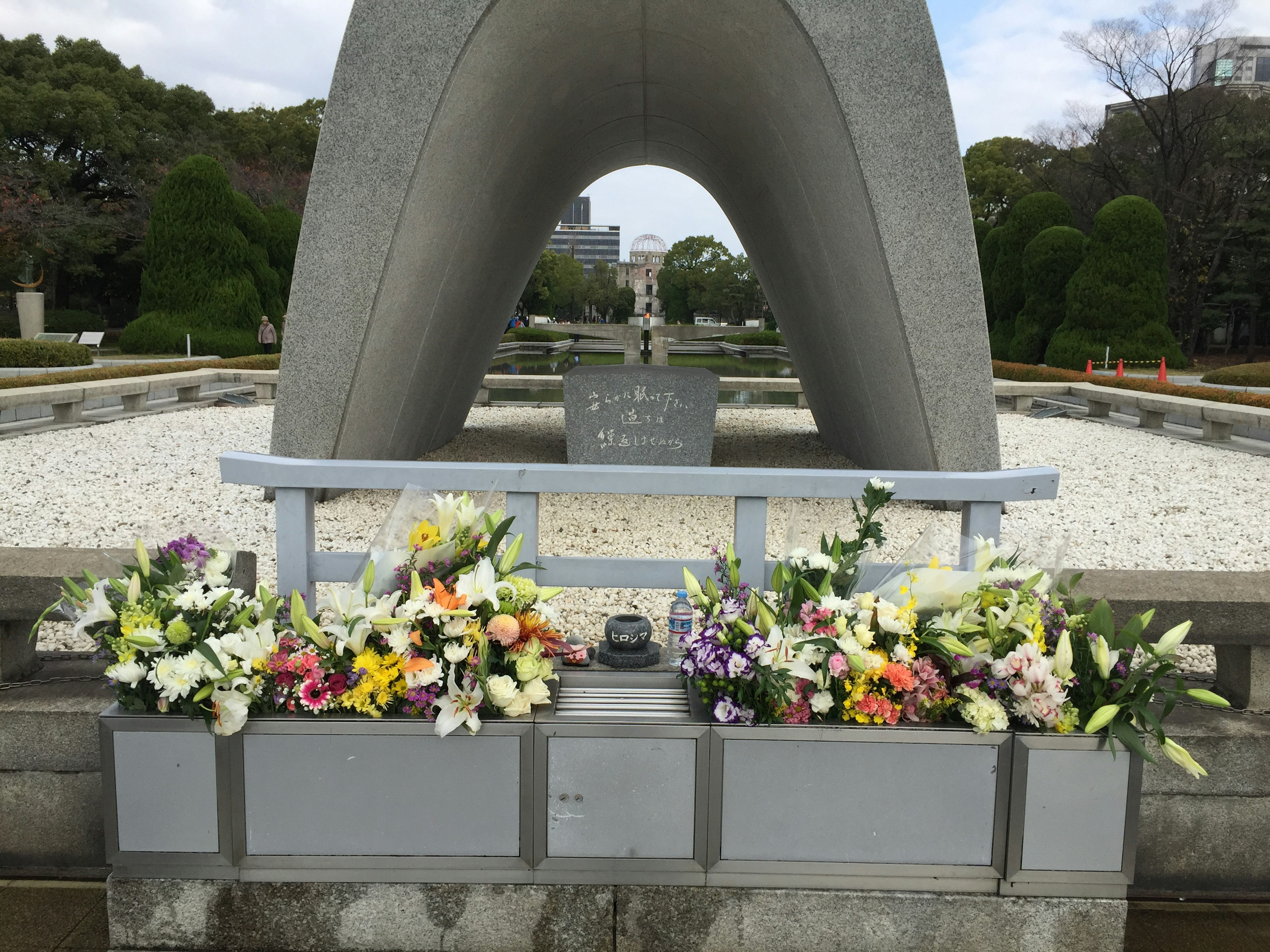 Arch-shaped monument at Peace Memorial Park adorned with colorful flowers