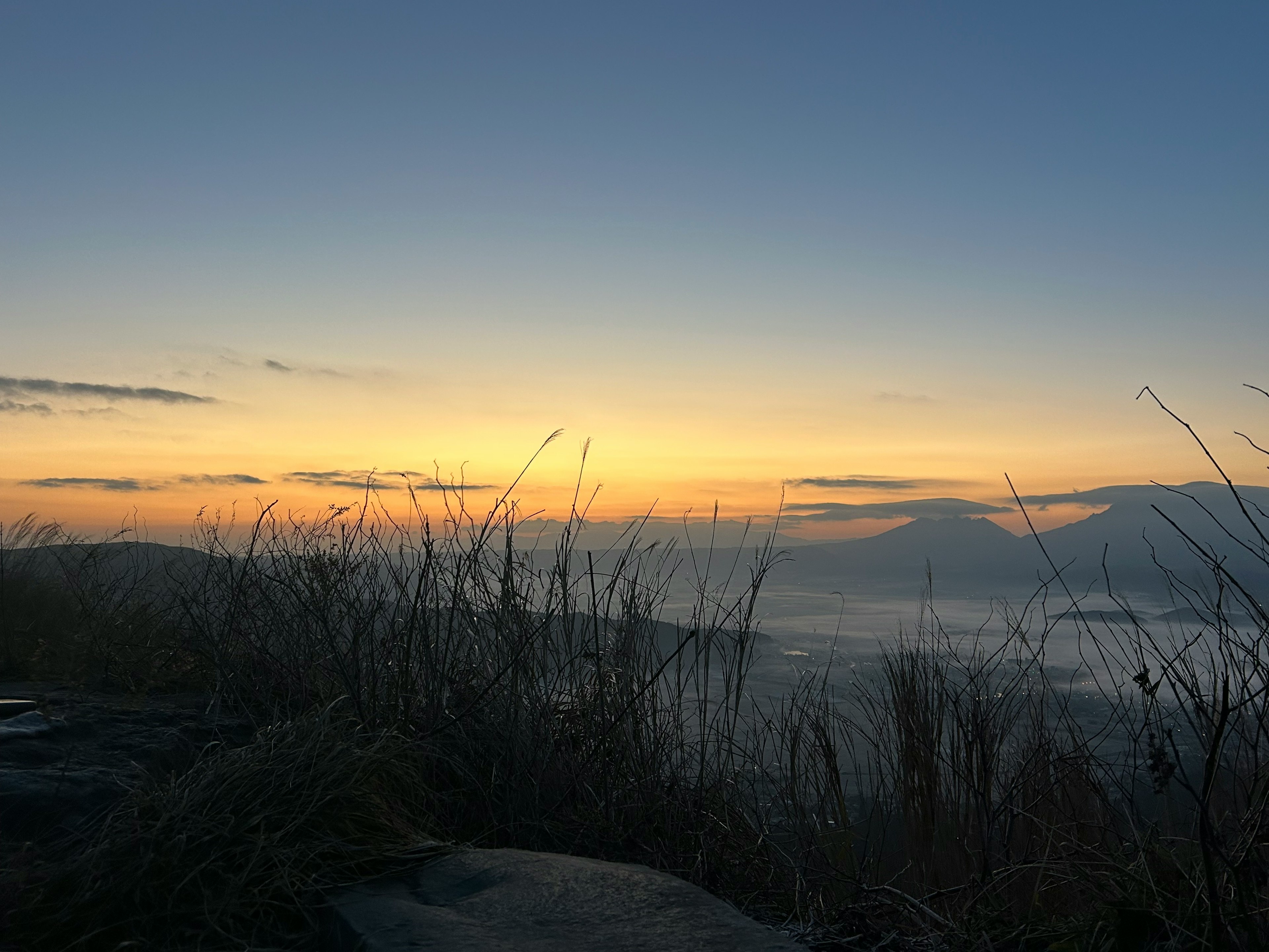 Dawn landscape with mountains and misty valley