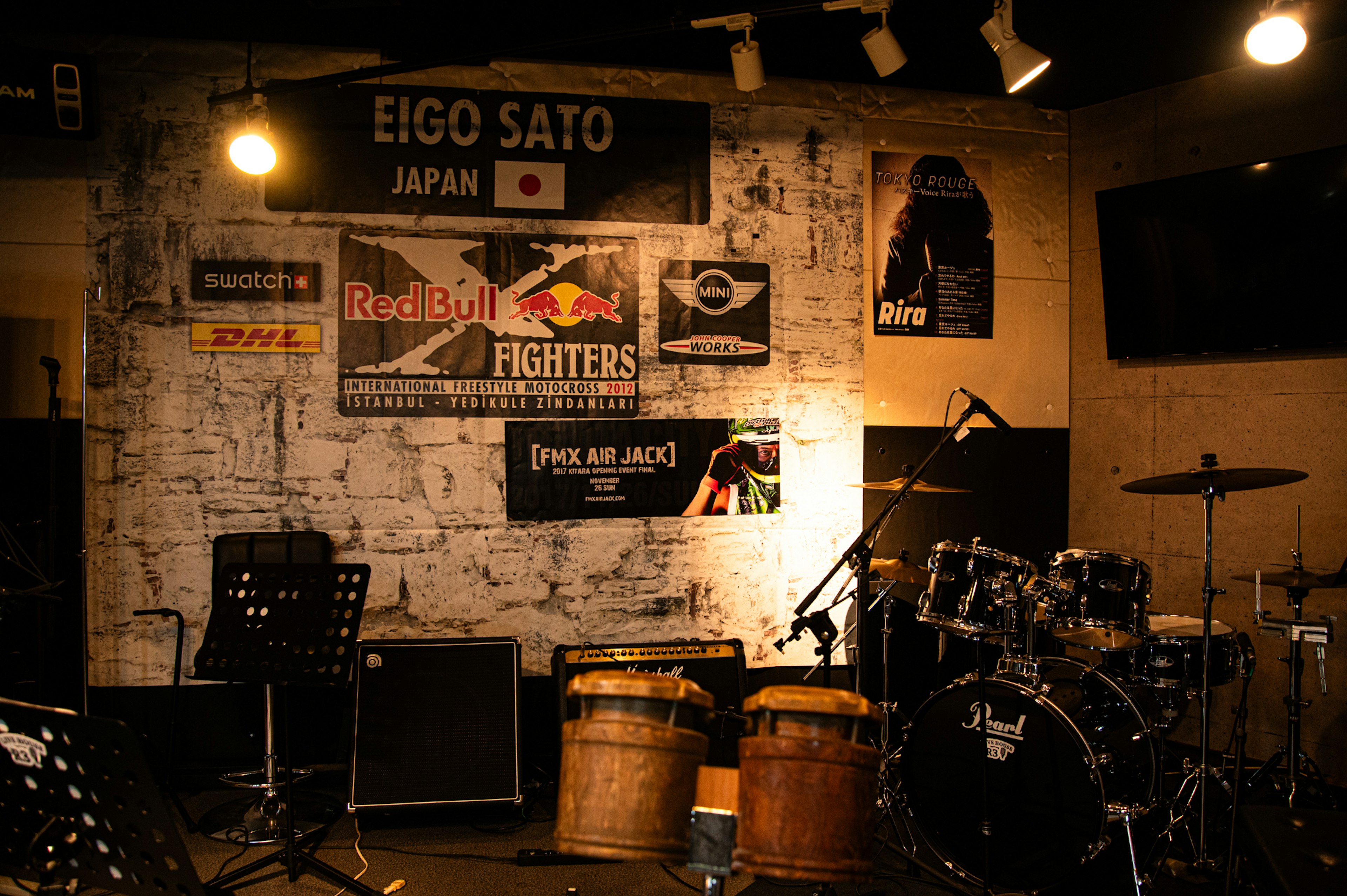 Live music venue featuring instruments and posters in Japan