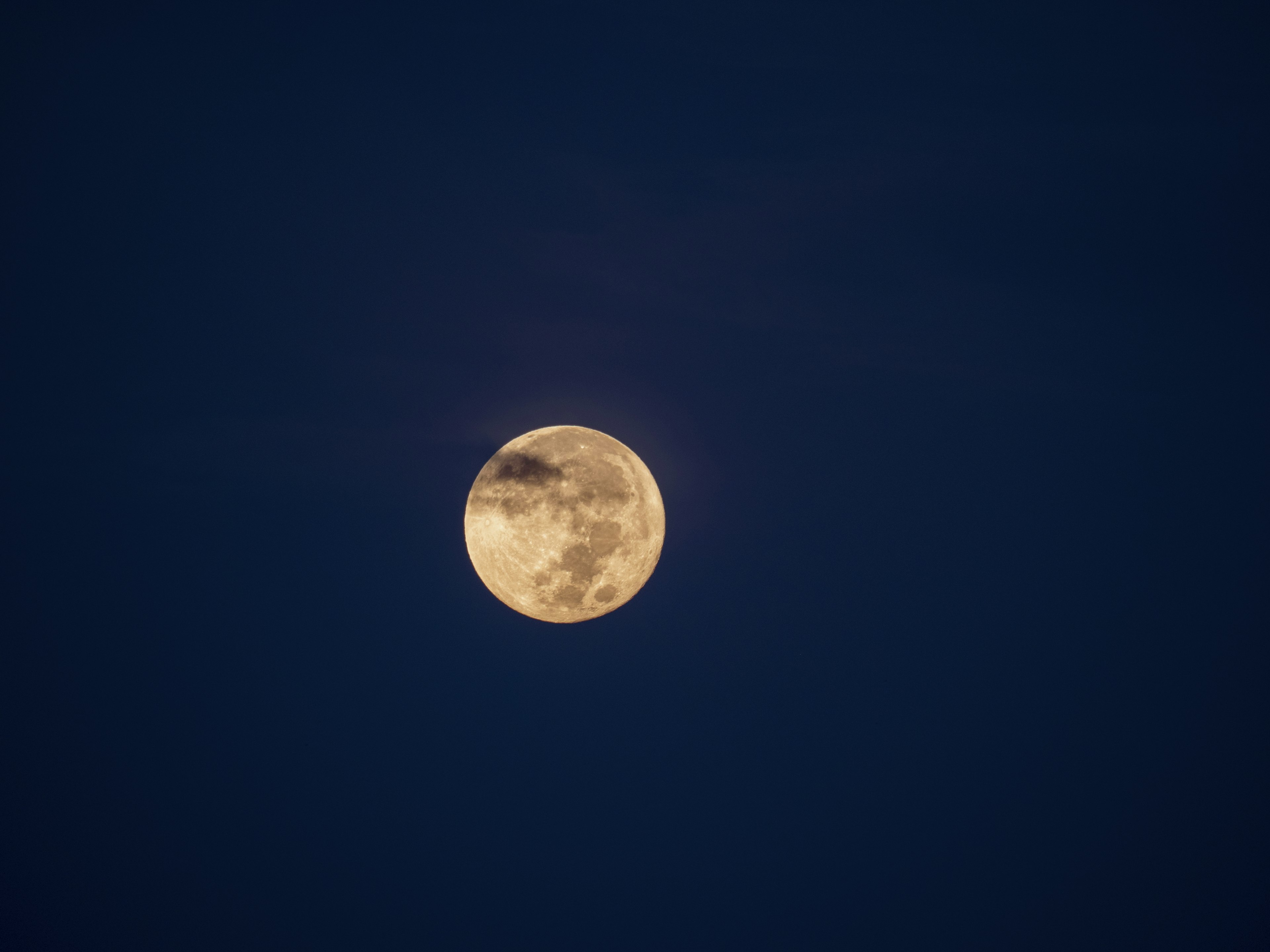 Close-up of a bright moon in the night sky