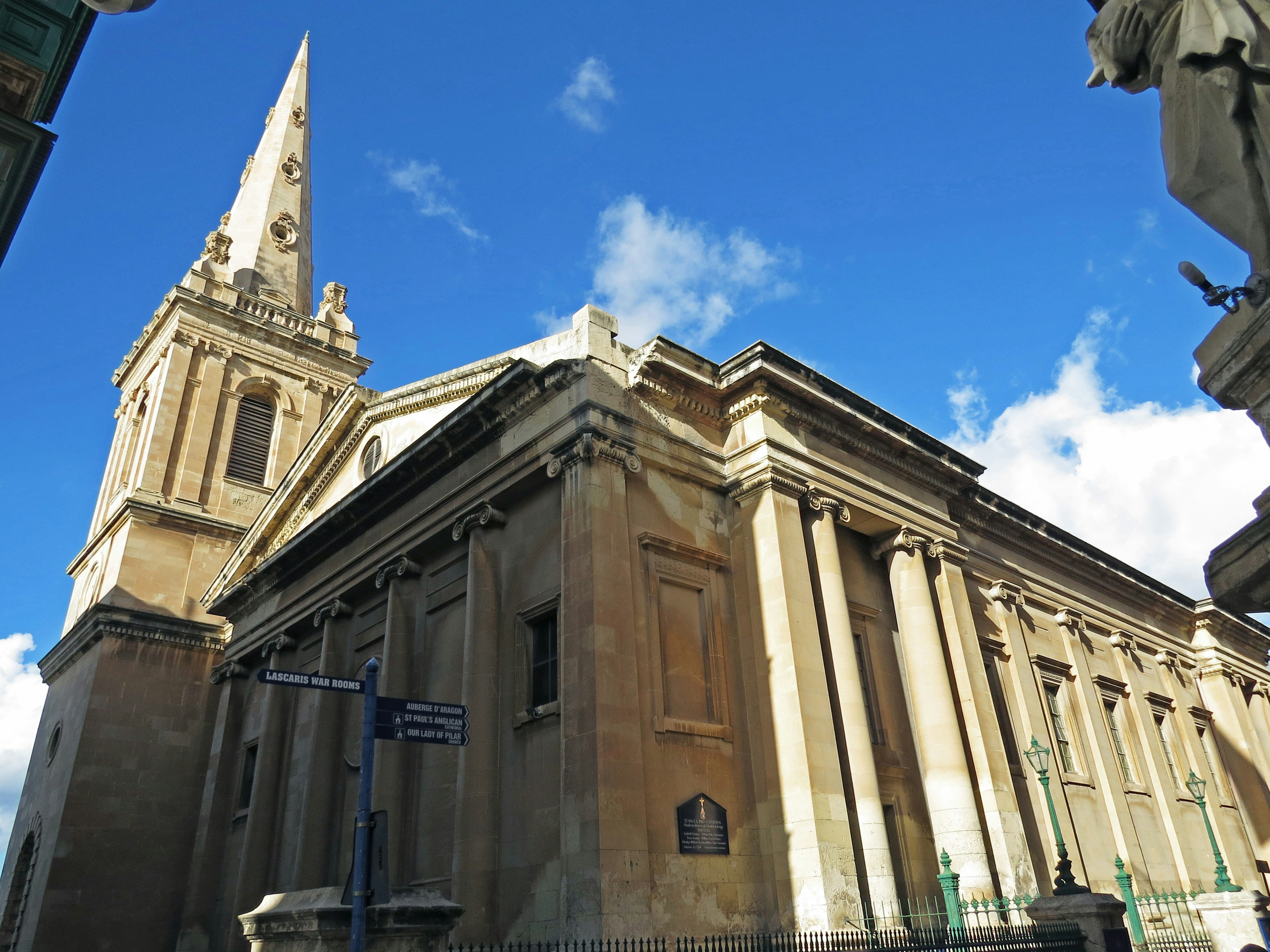 A grand church building towering under a blue sky