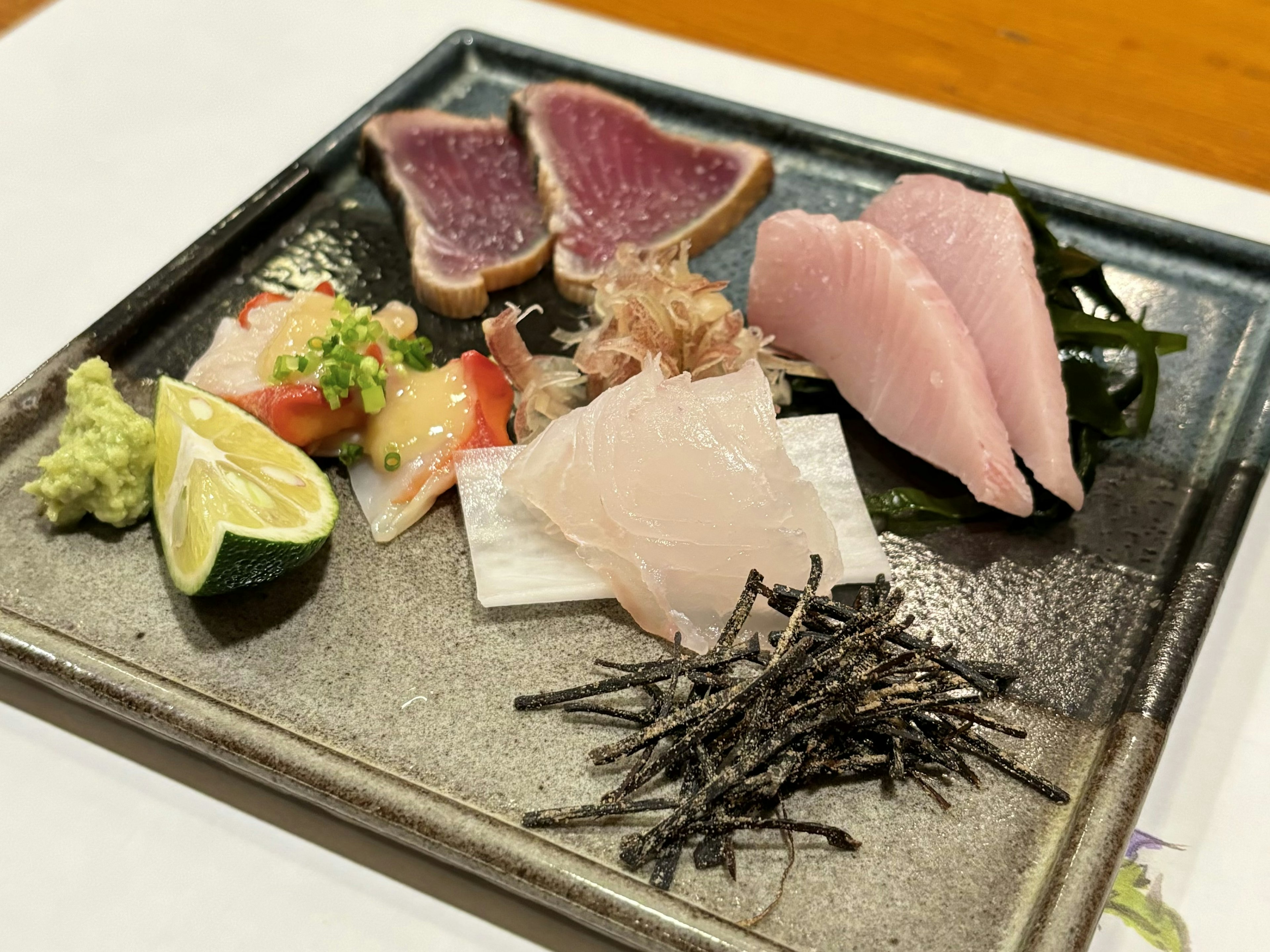 Fresh sashimi platter with garnishes