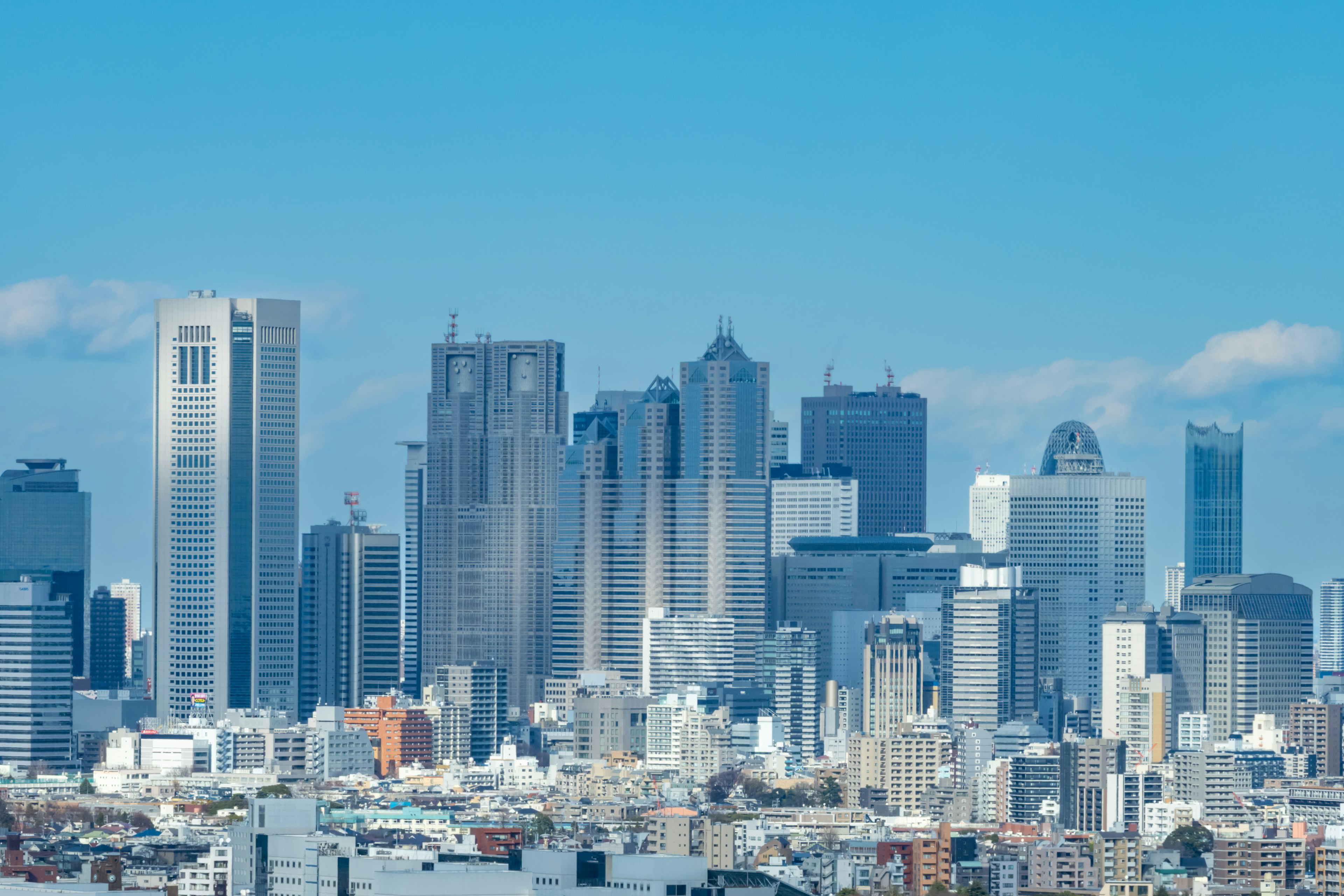 City skyline featuring tall buildings under a clear blue sky