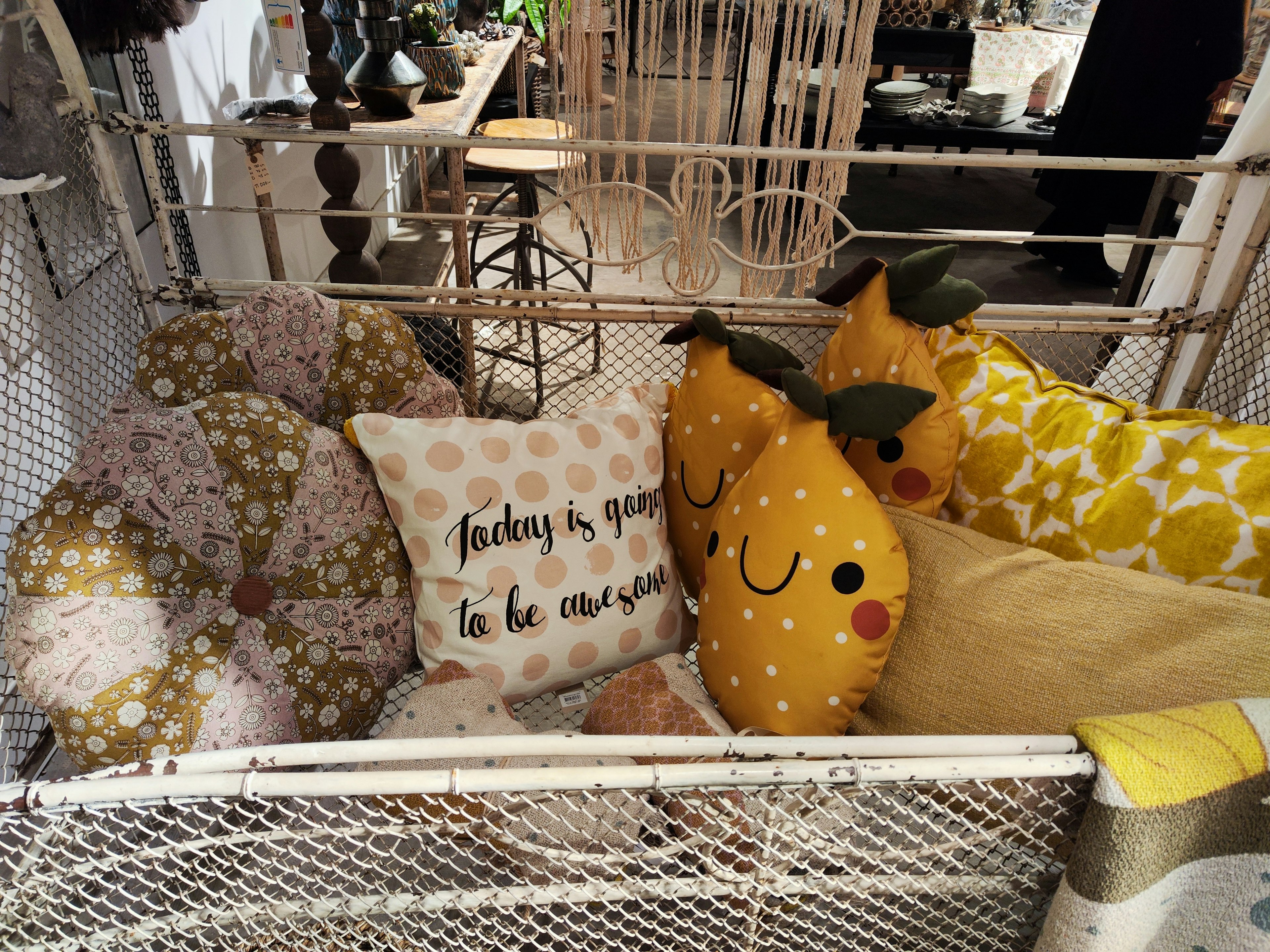 Colorful cushions and fruit-themed cushions arranged in a cozy interior corner