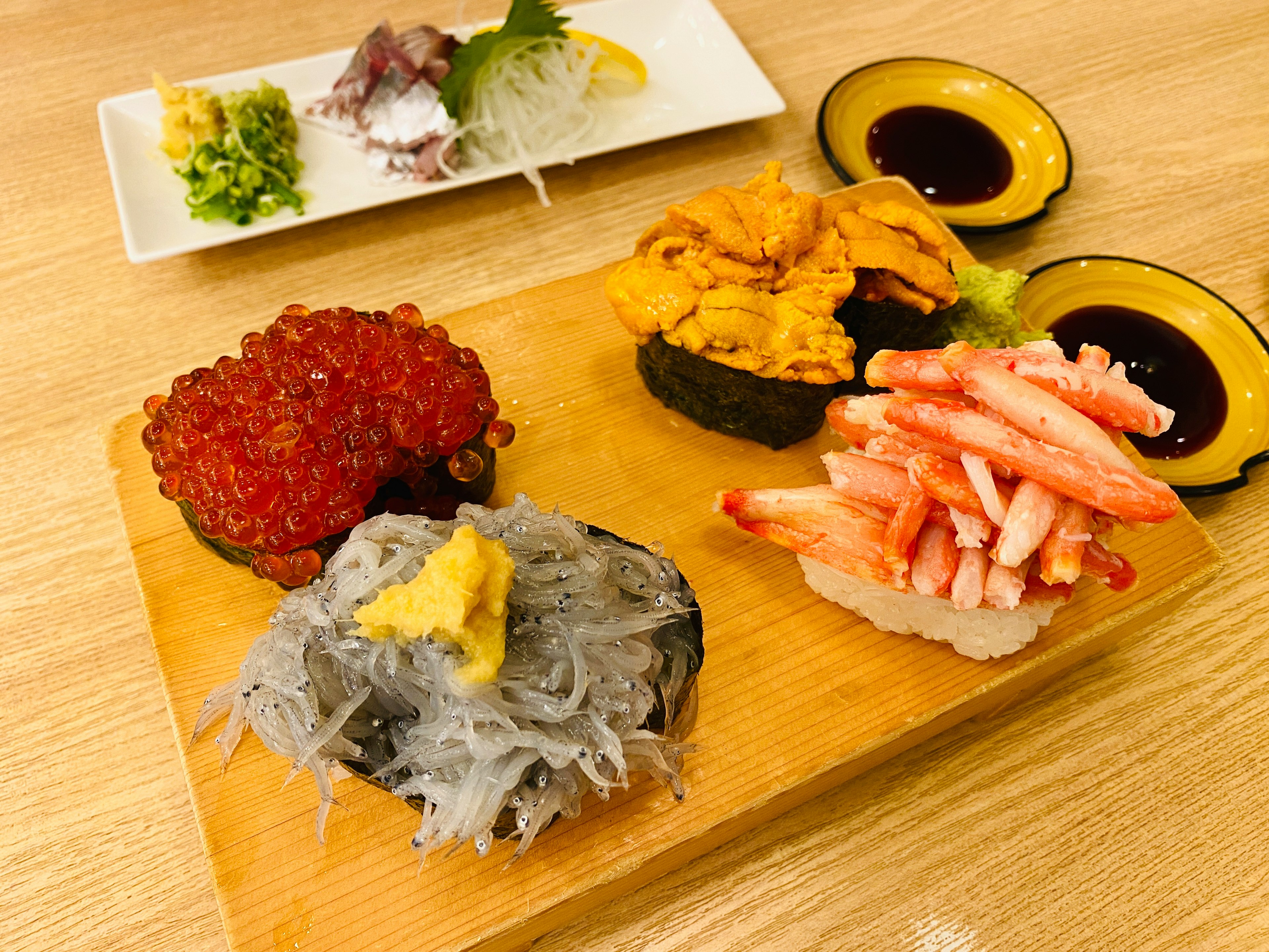 Fresh sushi assortment with sashimi plate