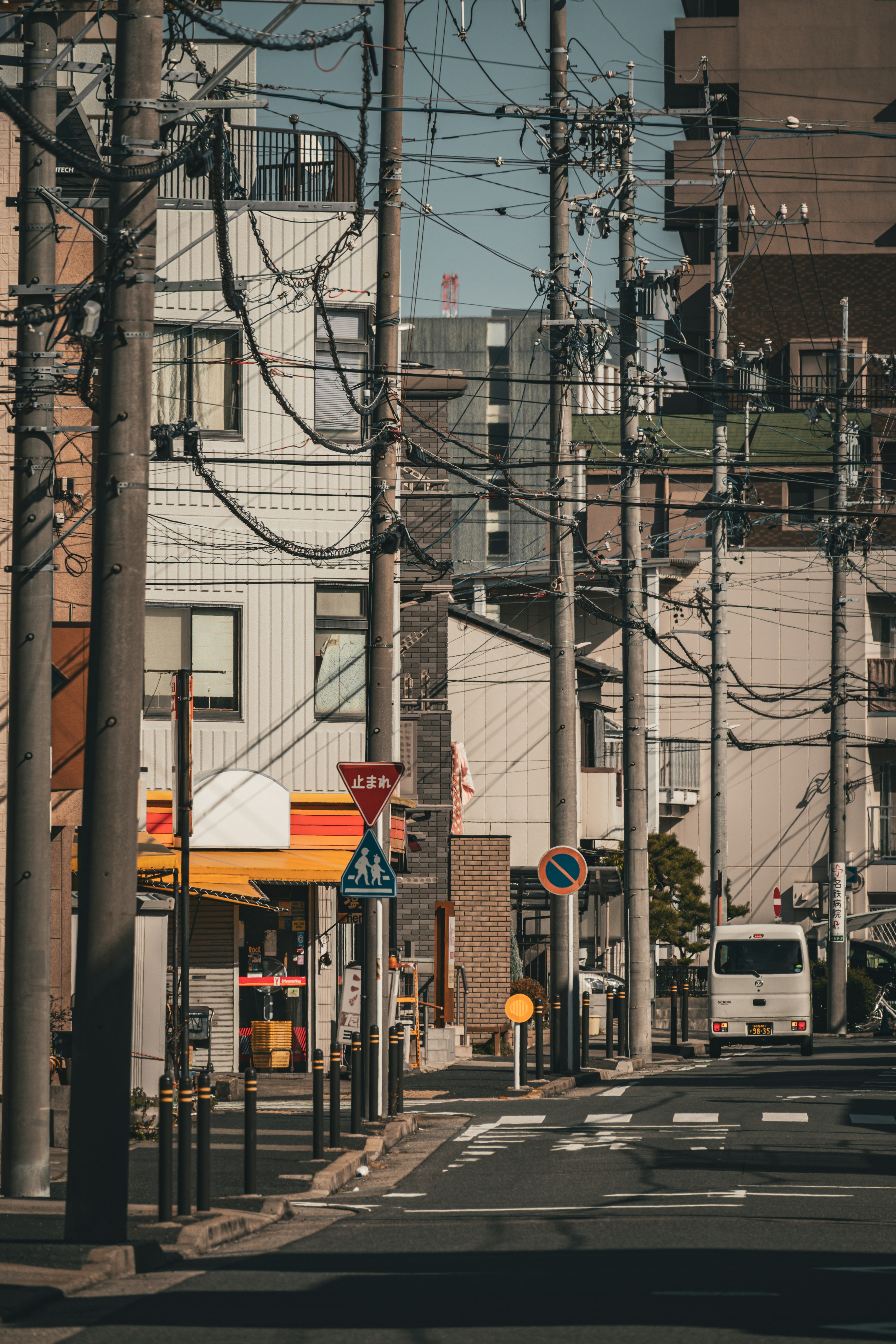 Urban street scene with power lines and buildings