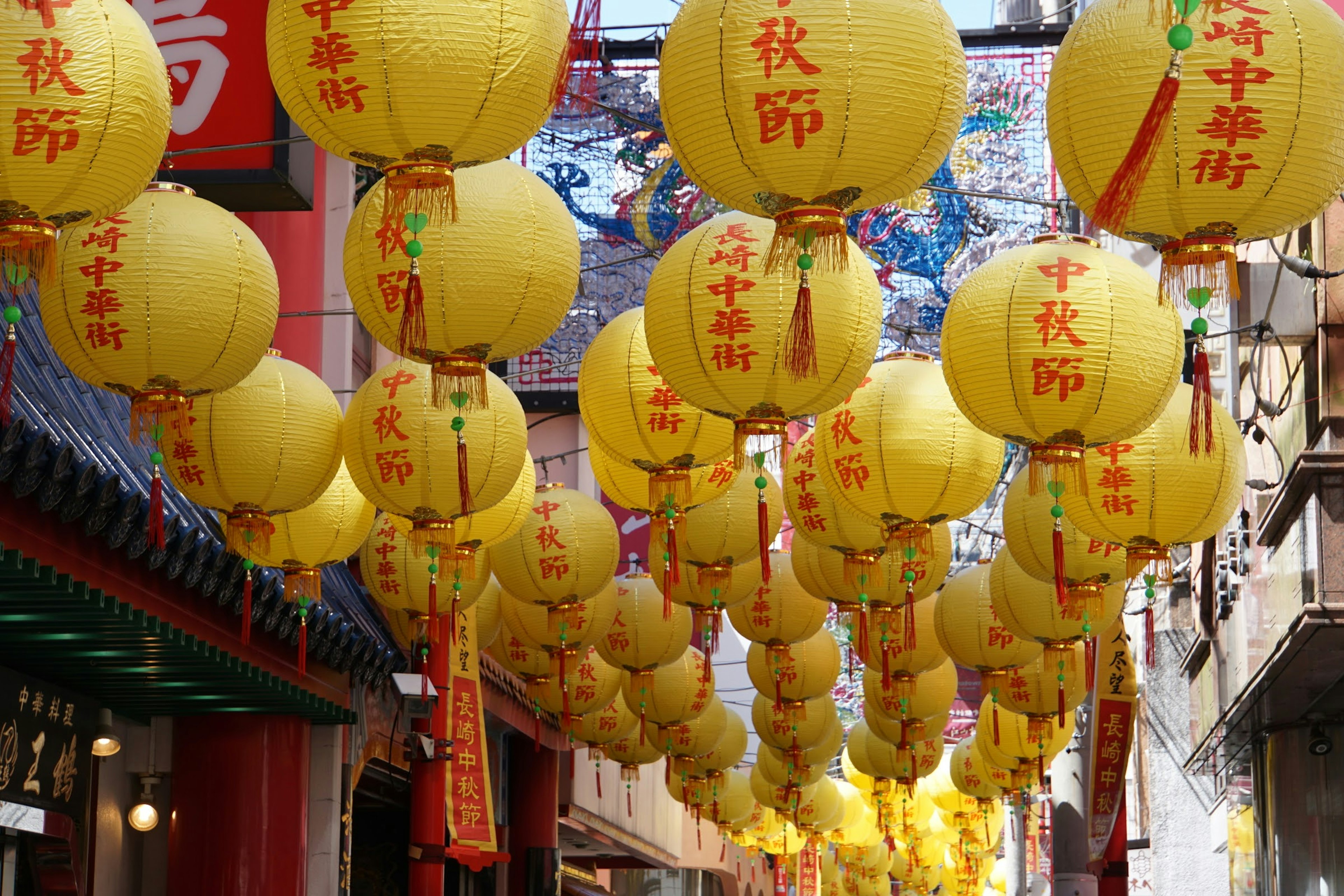 Street scene adorned with yellow lanterns