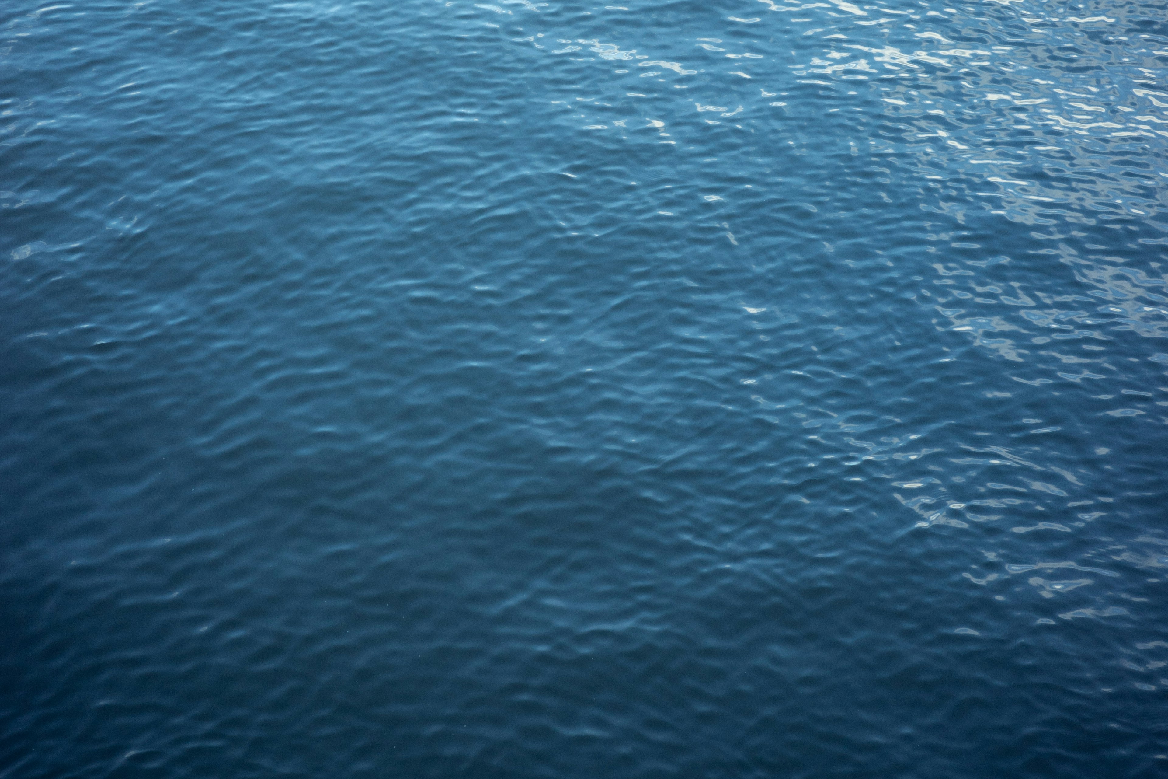 Textured surface of blue ocean water