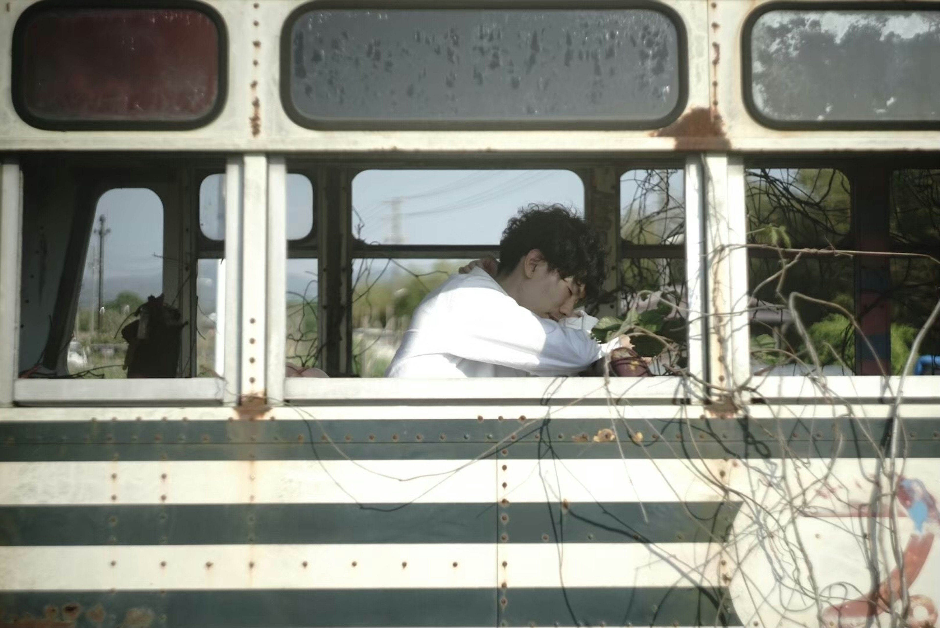 Person gazing out of an old bus window