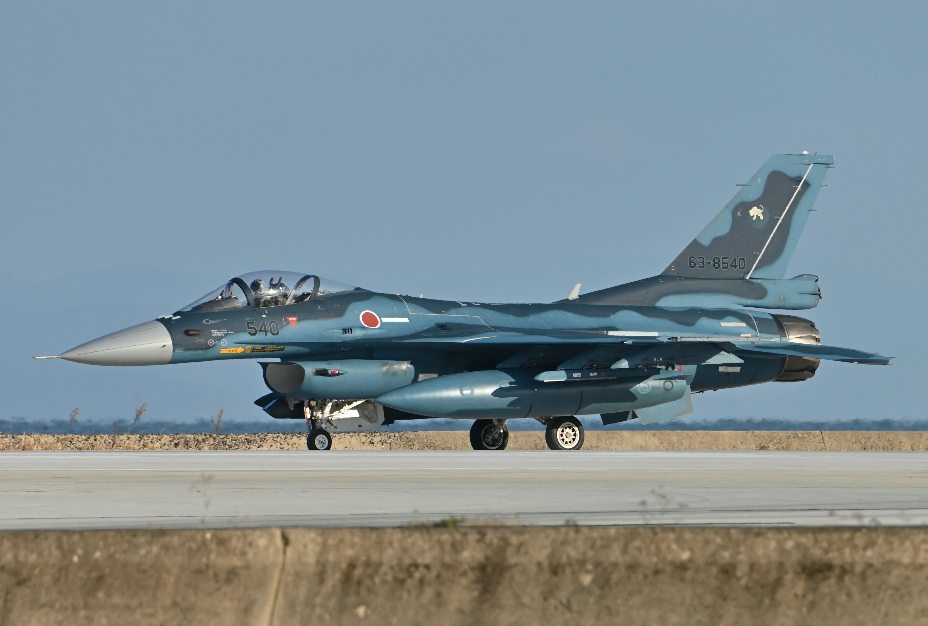 Japanese F-2 fighter jet taxiing on the runway