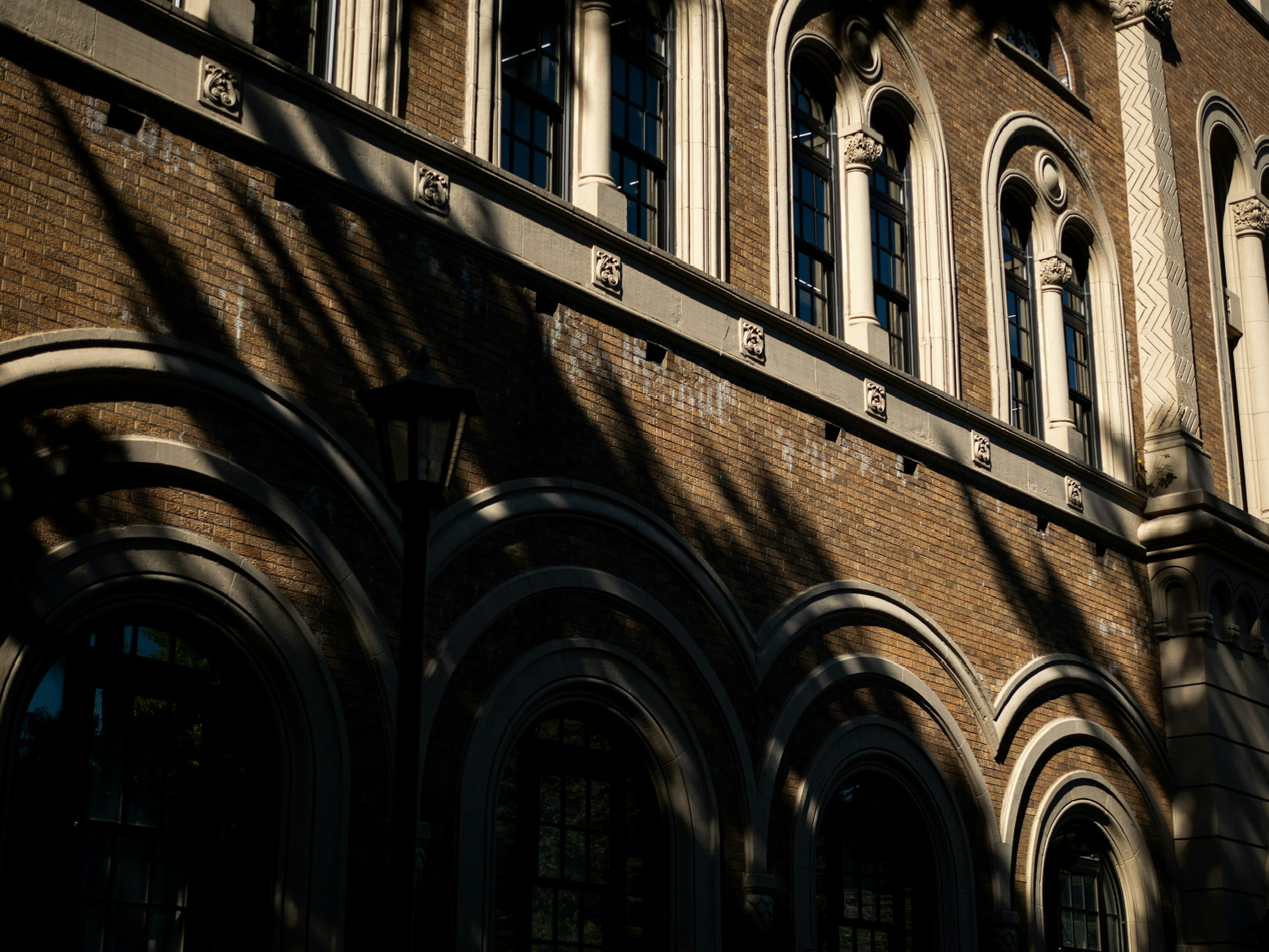 Historic brick building exterior with shadows