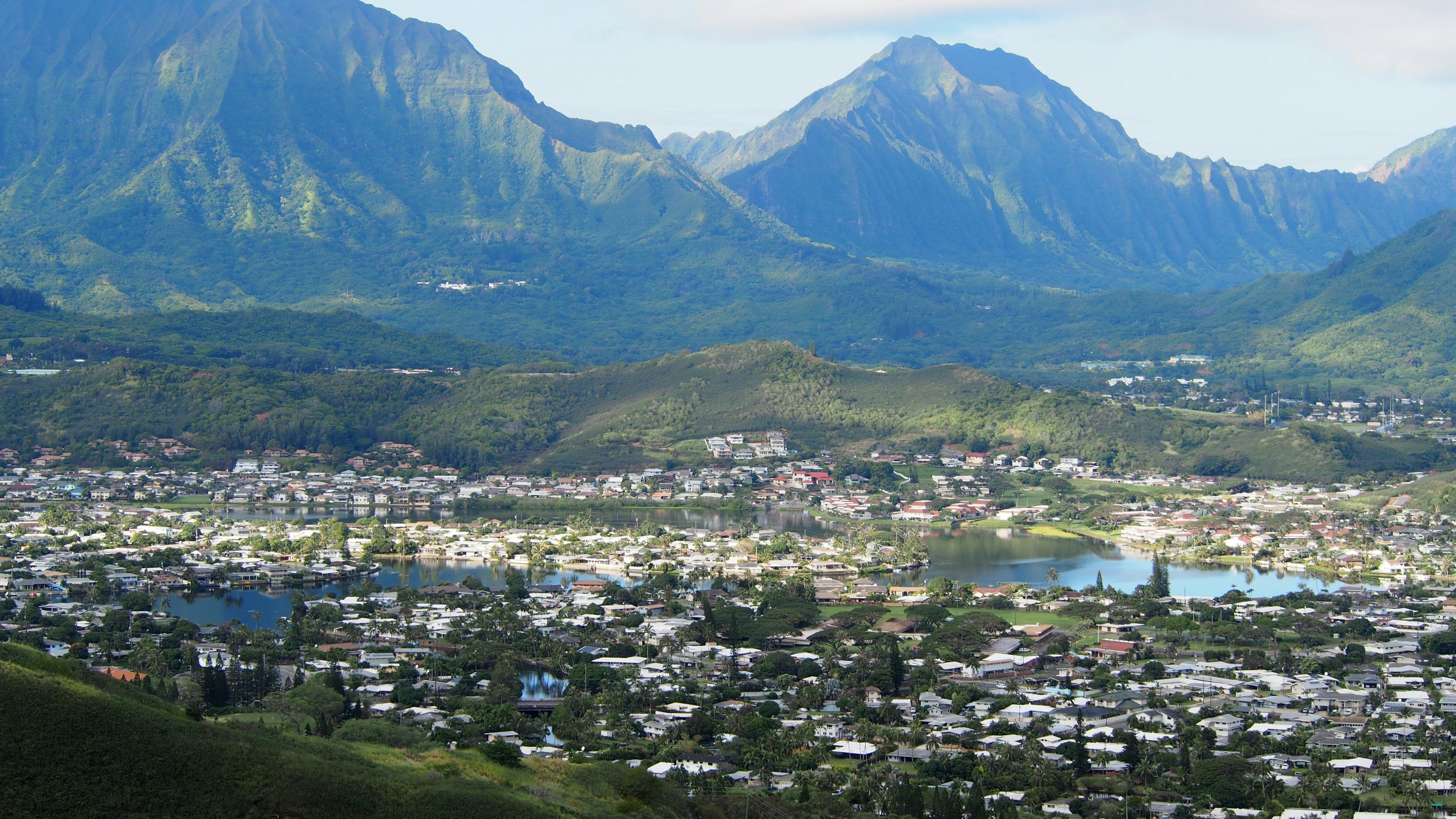 Panoramic view of a town surrounded by beautiful mountains