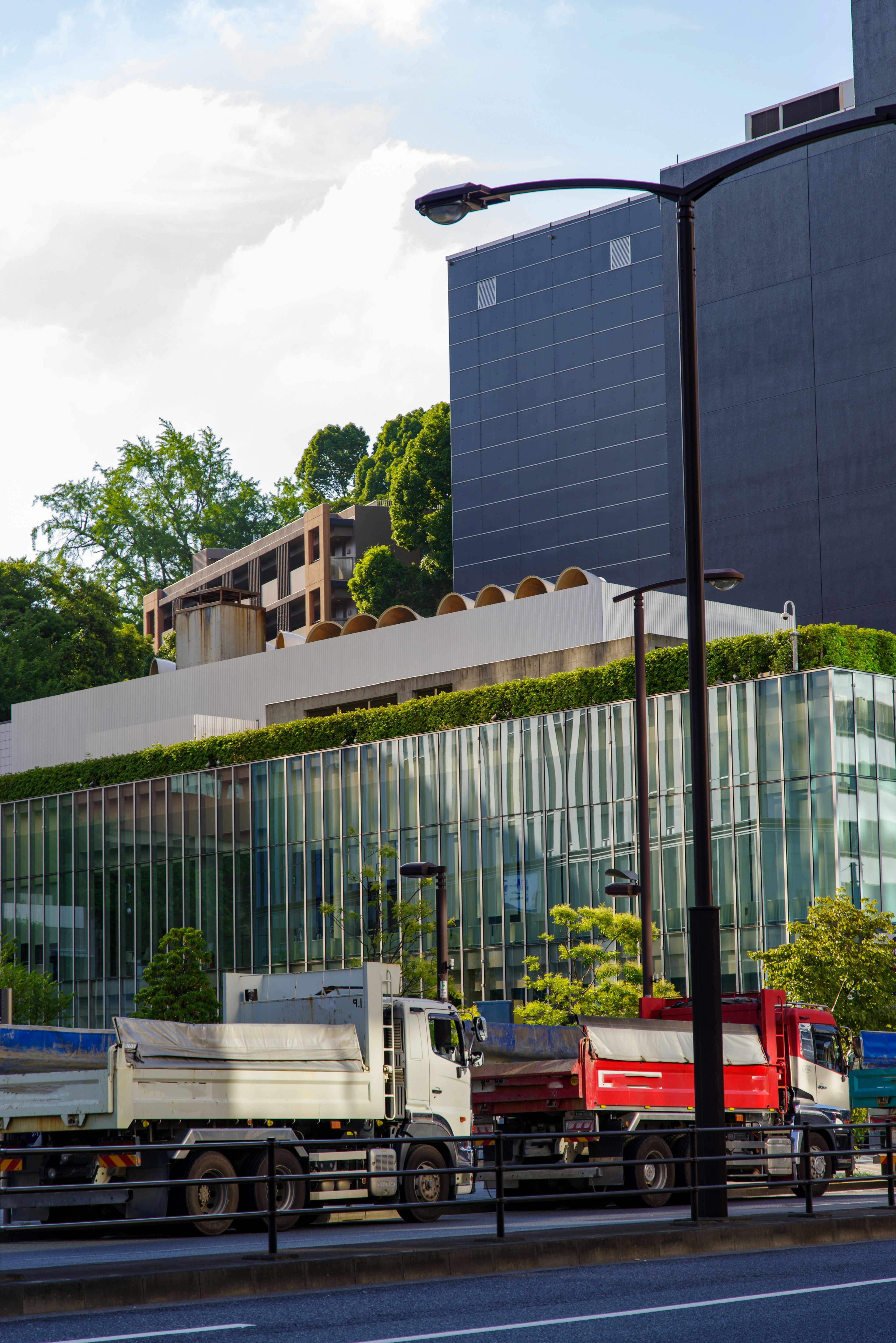 Modern building with a green rooftop in an urban setting