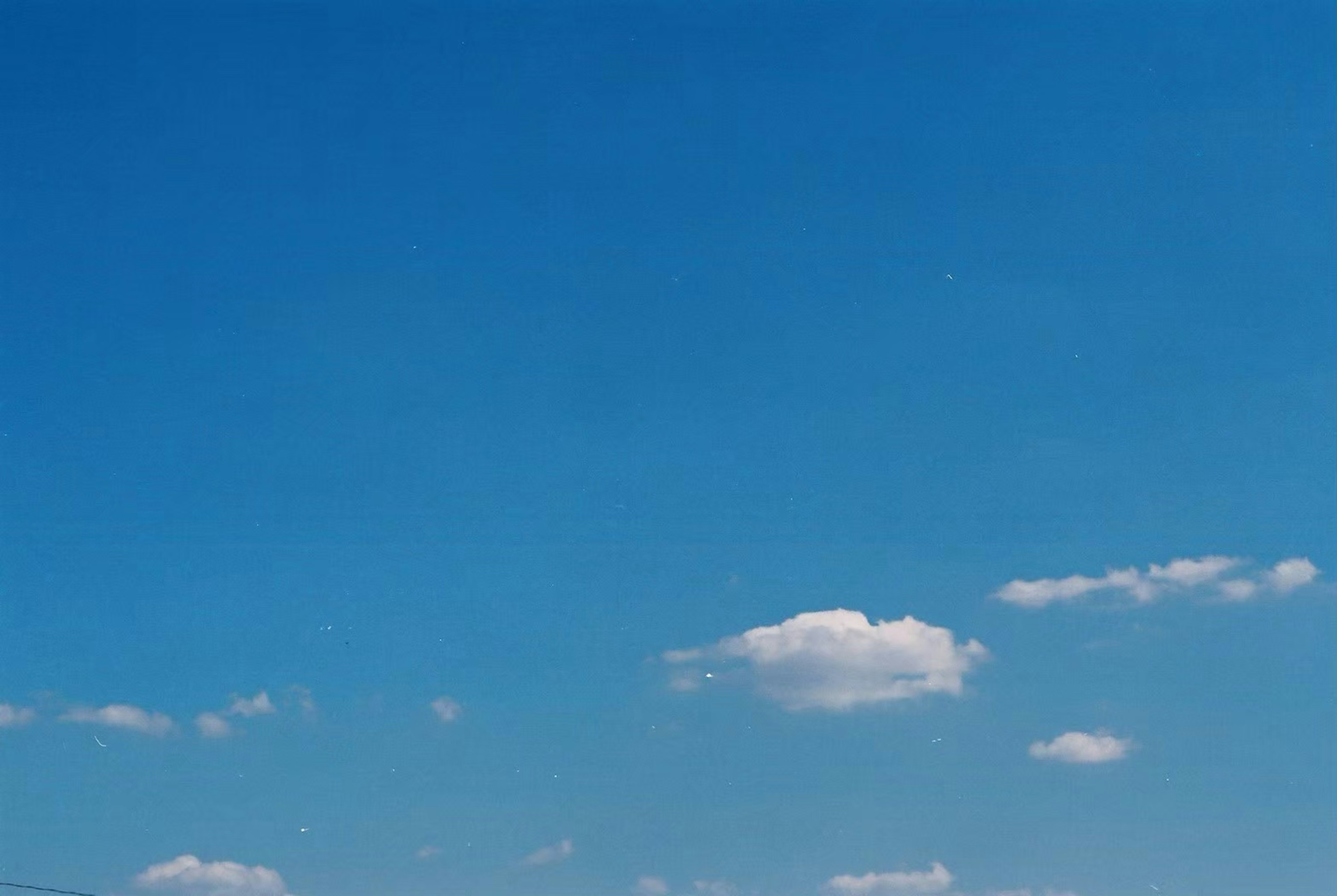 Clear blue sky with white clouds