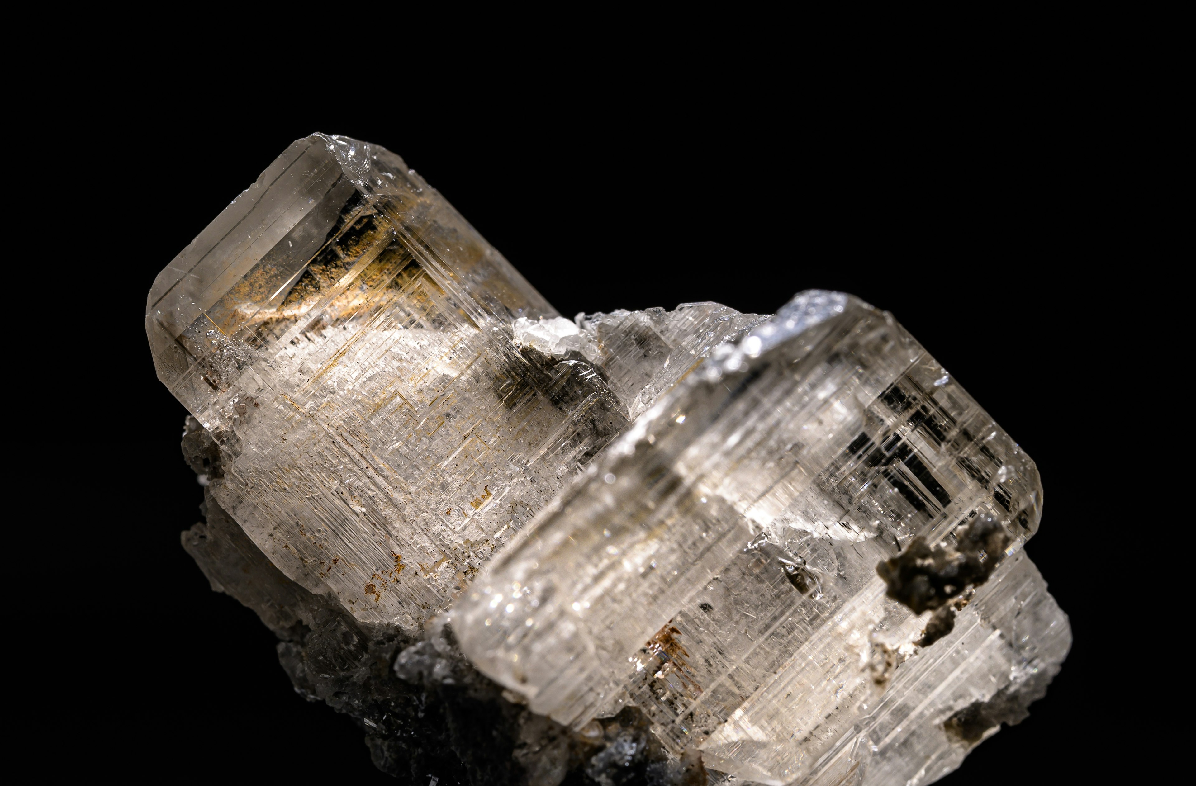 A cluster of transparent crystal with a black background